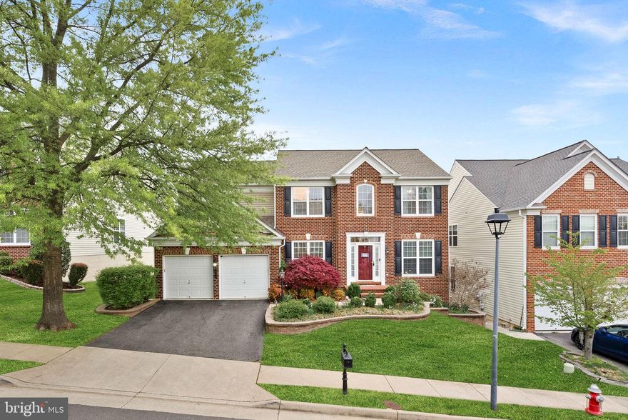 Welcome to 8192 Douglas Fir Drive—a beautiful 4 BR/3.5 BA brick-front Colonial Emory model by award-winning Pulte Homes, ideally nestled in the highly sought-after Laurel Hill community in Lorton. Surrounded by lush trees and top-tier amenities, this thoughtfully designed home includes a two-level rear extension and offers a spacious, flexible layout perfect for comfortable living and entertaining.

Upon entry, you’re welcomed by a dramatic two-story foyer flanked by a formal living room on the right—currently used as a home office—and a dining room on the left, thoughtfully repurposed as a study area. Continue through to the heart of the home: a  family room with cozy gas fireplace, open to the tiled kitchen featuring granite countertops, stainless steel appliances, a large center island, built-in desk area, and an adjoining sunroom that’s perfect for casual dining or your morning coffee.

Step outside through the glass door and enjoy multiple outdoor living spaces, including a low-maintenance deck with stairs leading to a fully fenced backyard and a paver patio—ideal for grilling, entertaining, or relaxing in your private outdoor retreat.

From the two-car garage, enter through the mudroom, complete with a coat closet for convenient storage. Just off the mudroom, a powder room is tucked to the left, and a separate door leads to the dedicated laundry room, keeping everything organized and easily accessible.

Upstairs, the elegant primary suite is a true sanctuary, featuring a tray ceiling, two walk-in closets (one with a laundry chute), a sitting area, and a spa-like en-suite bath with dual vanities, soaking tub, and separate shower. Three additional bedrooms and a full bath complete the upper level.

The fully finished walk-out lower level offers incredible versatility with a large recreation room, a den (or potential 5th bedroom), two additional flexible-use spaces, a full bath, and a dedicated storage/utility room—ideal for guests, hobbies, fitness, or working from home.

Pricing reflects the opportunity to personalize with fresh paint and flooring of your choice.

Residents of Laurel Hill enjoy many amenities including a swimming pool with Summer swim team, tennis and pickleball courts, a clubhouse, community center, playgrounds, and scenic walk/jog/bike trails. Laurel Hill Elementary is located within the neighborhood, and South County Middle and High Schools are just across the street.

Also perfectly situated between the Pentagon, Fort Belvoir, and Quantico. Close to Laurel Hill Golf Club, shopping, dining, parks, and recreation—with easy access to Lorton VRE, Franconia-Springfield Metro, bus routes, I-95, and Routes 123, 1, and 286.

This home offers the perfect blend of space, comfort, community, and location—a must-see in the heart of Laurel Hill!