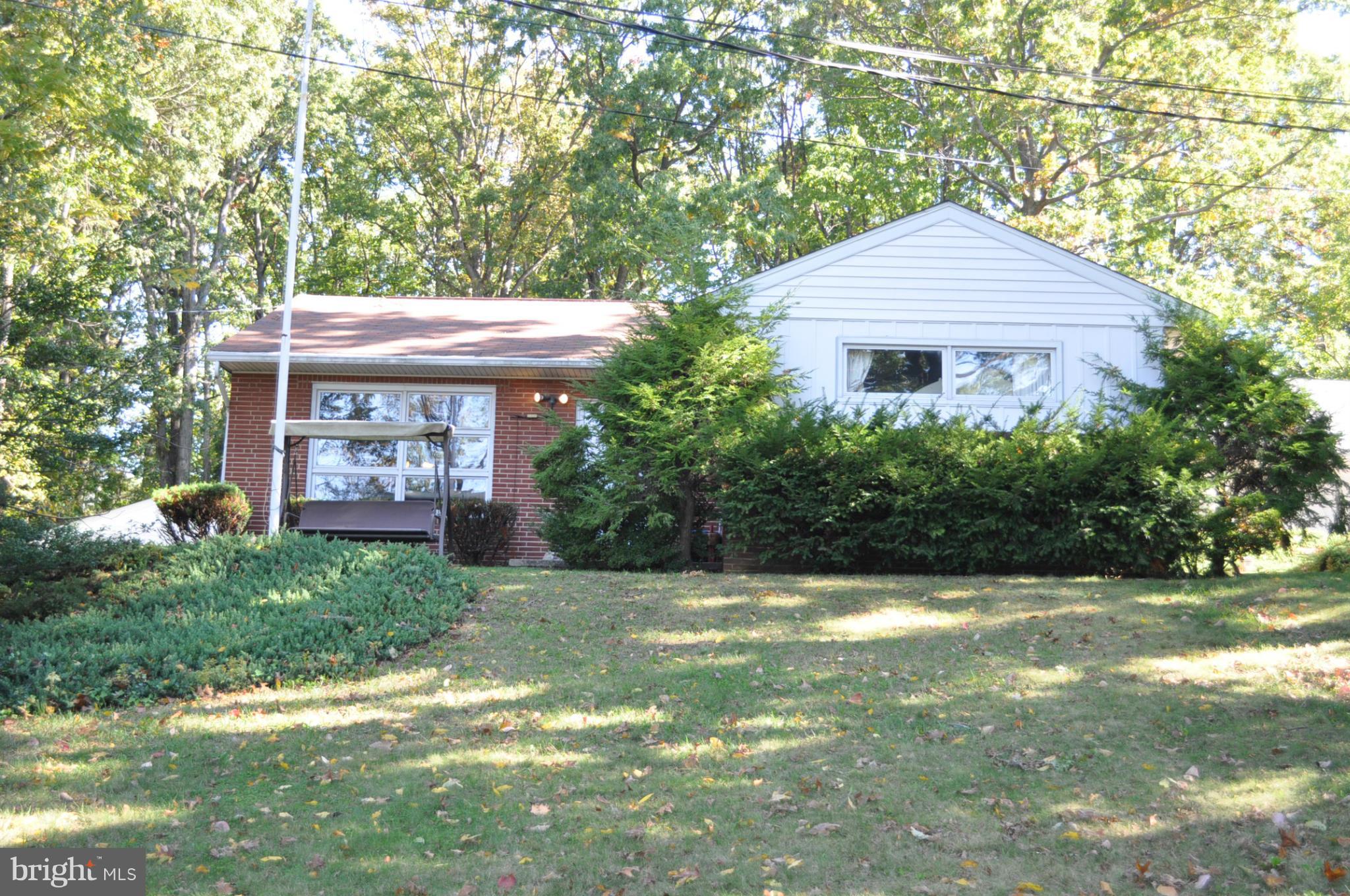 One Floor Living - Spacious Rancher w/ .64 acre lot that backs to woods includes 2 car garage, newly updated kitchen w/ granite and SS appliances, beautiful hardwood floors, main level family room w/ wood burning fireplace. Beautiful wood accents through-out. Lower level is improved w updated full bath. Close to downtown and commuter routes. Newer roof, furnace/cac