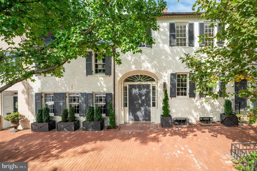 Experience the timeless elegance of this gorgeous reconstructed 1788 Georgetown residence at 1524 33rd St NW in historic Georgetown. Developed by Coba Properties with interiors by Martha Vicas Design and architecture by Dale Overmyer Architects, this expansive 6-bedroom, 6.5-bath home offers approximately 6,950 square feet of refined living space across 3 levels. The main level impresses with soaring 11'4" ceilings, custom designer finishes, and seamless walkout-level outdoor programming with a spacious patio terrace and large very private rear garden (delivered pool ready) which is perfectly suited for entertaining. The gourmet chef’s kitchen is outfitted with top-of-the-line appliances, custom cabinetry, expansive marble island, as well as an adjacent Butler’s Pantry. Upstairs, the luxurious Primary Suite features two large walk-in closets and a spa-like all marble primary bath with a soaking tub and oversized shower. There are three other bedroom suites on the 2nd level. The Lower Level with 9' ceilings is complete with a large Recreation Room and wet bar, Exercise Room, Two Bedroom Suites, Kitchen Pantry, and Laundry Room. An elevator services all levels. With coveted two-car parking, including a convenient car lift, this home combines historic charm with modern amenities. 1524 33rd St NW is situated near Volta Park and within easy walking distance to Yellow Café, the George Town Club, Stephen Starr's new Osteria Mozza restaurant, and many more vibrant dining and shopping options on Wisconsin and M Streets.