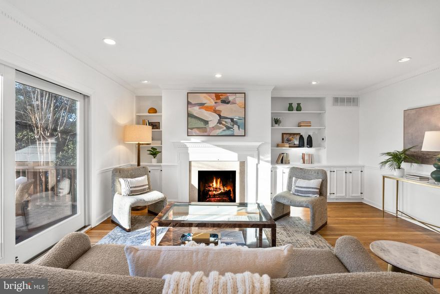 Perfectly positioned in Old Town’s coveted SE Quadrant, this beautifully refreshed townhome offers historic charm, modern comfort, and unbeatable convenience. Just a few blocks from the waterfront and the vibrant shops and restaurants of King Street, you’ll love being able to stroll to local dining, shopping, and scenic river walks—while still enjoying easy access to everywhere you need to go.
A true commuter’s dream, with public transportation very close by.  King Street Metro is less than a mile away, and major commuting routes place Amazon’s HQ2, Crystal City, Washington, DC, and National Harbor just minutes from your home. Inside, the home feels bright, welcoming, and thoughtfully updated with fresh paint in Cloud Dancer (the Pantone Color of the Year), new LVP flooring on the main level, and refinished hardwood floors throughout the upper levels. With over 1,900 square feet of above-grade living space, the layout is both generous and functional, featuring three bedrooms, two and a half baths, and multiple spaces to relax or entertain. The spacious kitchen flows easily into the living areas, while two fireplaces add warmth and character. The upper-level family room showcases beautiful built-ins surrounding the fireplace and opens to an expansive deck, perfect for morning coffee or evening gatherings. On the main level, the living room offers direct access to a fenced brick patio, creating a private outdoor retreat ideal for entertaining or simply unwinding. Additional highlights include recessed lighting, a bar area, washer and dryer in the unit, and a large primary suite with ensuite bath. Every detail has been thoughtfully refreshed to create a home that feels both comfortable and move-in ready. 
This is Old Town living at its best—walkable, connected, and designed for enjoying every moment.