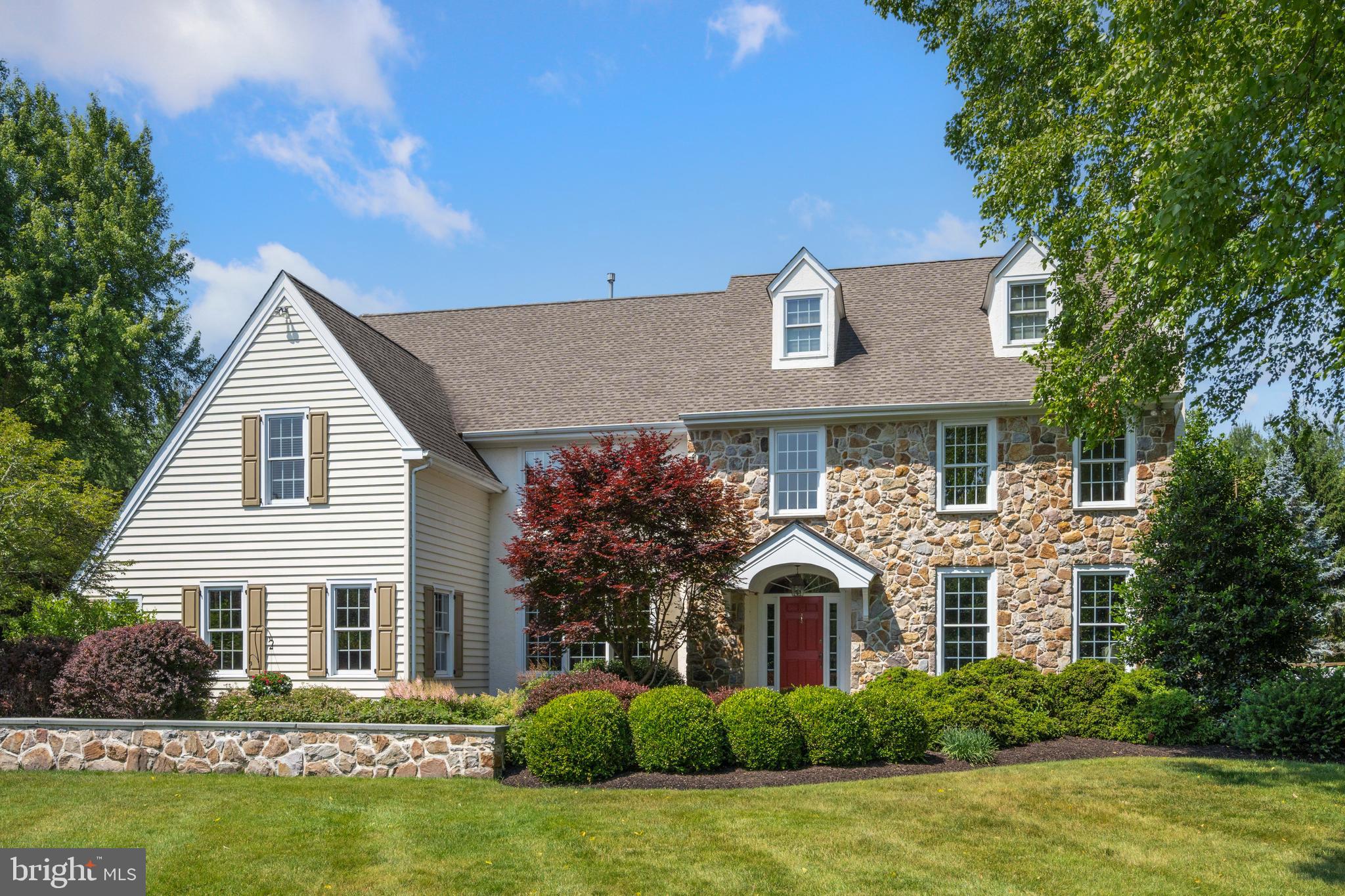 Welcome to this exquisite stone front, modern farmhouse style home in Meadowview Farm Estates. This 5-bedroom, 3-full bath, 2-half bath, 3-car garage home sits on a quiet cul-de-sac and is very private. The 1.06-acre lot offers mature trees and is professionally landscaped. The backyard has an expanded flagstone patio and overlooks a serene, manicured yard with large shade trees and a new vegetable garden.
The first level has a two-story foyer with hardwood flooring and a large palladium window that adds plenty of light. The formal dining room is great for entertaining and holiday gatherings, and includes hardwood floors and a large triple window. The renovated living room has four beautiful windows, new carpet and lighting, and a wood-burning fireplace. The kitchen offers glazed wood, soft-close cabinetry, a farmhouse sink, granite counters, and a large pantry. Appliances include a high-end Wolf range/oven, Wolf microwave, Liebherr built-in refrigerator, and Bosch dishwasher. There is a large arched window over the kitchen sink with plenty of natural light and a beautiful view of the scenic backyard. The large, two-story family room has hardwood floors and a beautiful floor-to-ceiling wood-burning fireplace with black granite. The first level concludes with an office/study with hardwood and triple windows overlooking the backyard, two half-baths on either end of the house, and two staircases to the second floor.
The second level has new carpeting throughout. It begins with a large master bedroom and adjoining master bath with tiled shower, Jacuzzi tub, and double vanity. Off the upstairs hallway there are three additional spacious bedrooms and a full bath. To complete the second floor there is a guest suite with separate full bath, sitting area, and bedroom.
The largest portion of the basement is finished and is ready for games, music, or exercise; it includes new flooring and acoustic ceiling tiles. Off the finished portion of the basement, there are two large unfinished portions for storage. The house has two HVAC units and a new hot water heater.
This home is one of 16 homes in Meadowview Farms Estates. It is situated near Whole Foods, Starbucks, downtown Ambler with dining and theater, shopping malls, walking trails, township parks, ballfields, libraries, the YMCA and plenty of top restaurants. It is forty minutes from downtown Philadelphia and the airport with very convenient access to Septa’s regional rails. To top it all off, this home is in the award winning, most sought after Wissahickon School District.