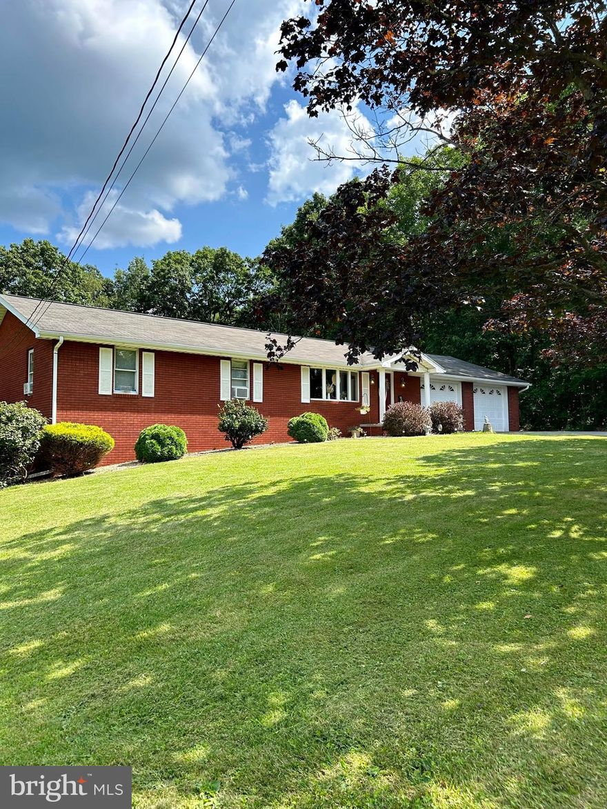 This beautiful brick rancher nestled right outside of the city of Frostburg offers the perfect place to call home. Featuring 3 bedrooms and 1 full bath upstairs (double sinks!), fresh carpet throughout, spacious eat in kitchen, and access to your attached 2 car garage. Head downstairs for more finished square footage with the finished basement and another full bath. The real charmer though is the lovely sizable deck off the kitchen that showcases your sizable, flat yard.  Speaking of outside there is NO shortage of storage with a storage shed for your lawn equipment AND a double 2 bay garage that could potentially fit 4 vehicles. This home also features a second lot that gives you all that space in your manicured yard, about +/- 1 acre.  Ranch homes are are very desired so don't delay in owning your own little slice of quiet!