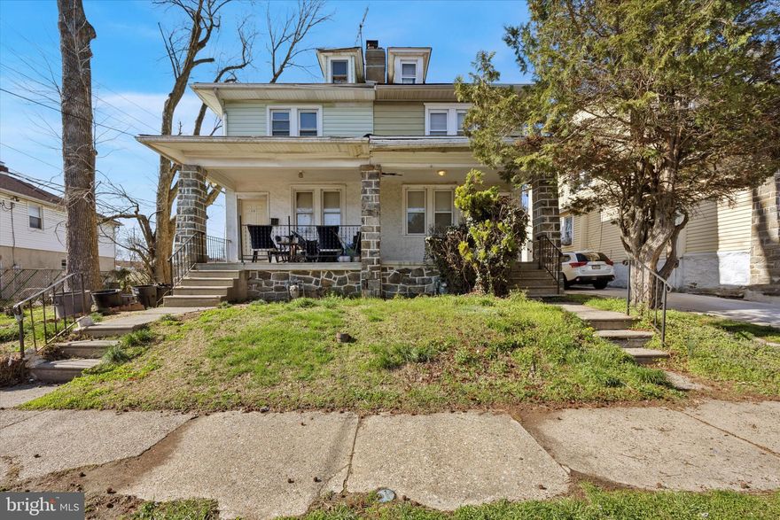 Discover the potential in this spacious twin home, featuring a charming covered front porch that invites you inside. This home would make a great investment or owner occupant opportunity. The first floor offers a welcoming living room with a fireplace, a bright dining room with a large window and ceiling fan, and a functional kitchen with vinyl flooring and gas cooking. A convenient mudroom at the back provides access to the fenced-in backyard. Mostly hardwood floors run throughout the first level, adding character and durability. Upstairs, you’ll find three generously sized bedrooms and a full bath with a tub-shower combo. The second floor is fully carpeted for comfort. Additional storage or expansion opportunities await in the walk-up attic, while the unfinished basement with Bilco doors provides even more possibilities. This home has great bones and is move-in ready with opportunities to make it your own. Ideally located near community parks, the train, and Baltimore Pike, this property is being sold as-is—don’t miss out on this fantastic opportunity! **Property is being sold as-is.