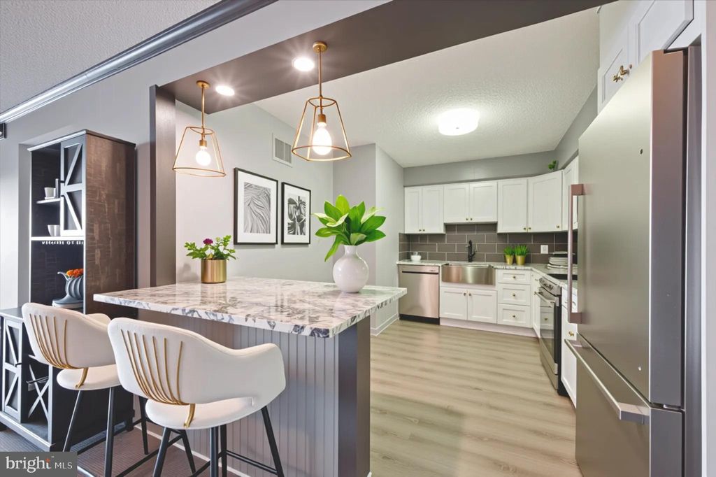 Photo of 21438 Valley Forge Circle #1438, KING OF PRUSSIA, PA 19406 (MLS # PAMC2135826)