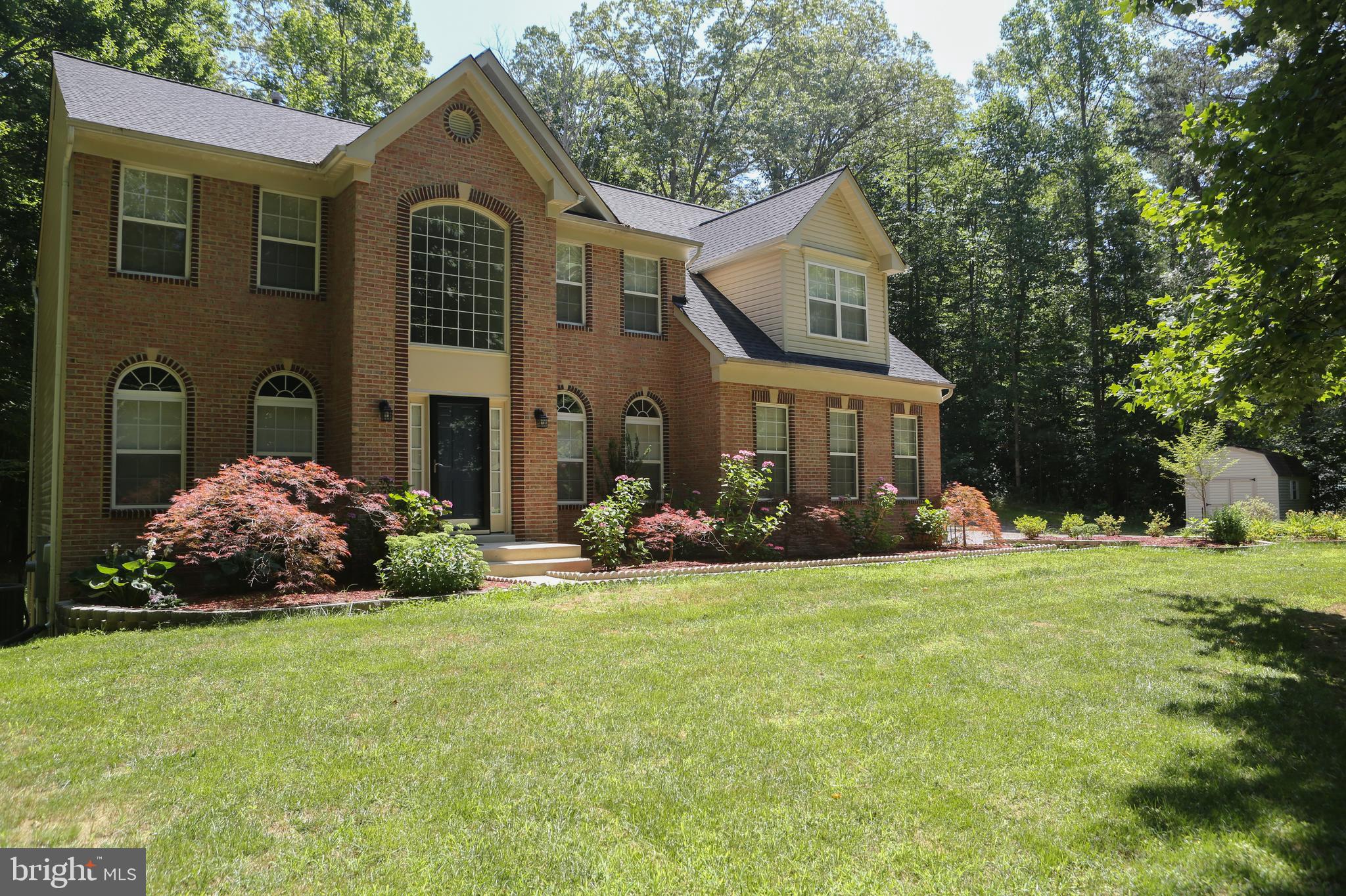 Privacy galore! 3000+ square foot home with an open floor plan. Large kitchen that flows into your family room makes this home perfect for entertaining. Family room is outstanding with it's high ceilings, fireplace, and large windows with lots of natural light. Upper level has plenty of bedrooms for a family with with a large master sure to impress. The basement is finished with a large rec room, bar & full bath. Storage shed out back. Property backs to trees giving plenty of privacy. Situated on 4.8 acres. Owner did many updates to the property roof & heat pump (2019), refrigerator& dishwasher (2018), 500 gallon propane tank is owned, ducts cleaned in 2020, new smoke/ CO detectors & so much more! Come see this amazing property for those seeking space to grow and privacy yet still in being in a neighborhood.