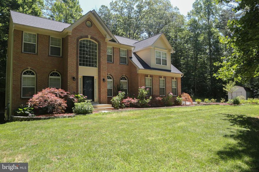 Privacy galore! 3000+ square foot home with an open floor plan. Large kitchen that flows into your family room makes this home perfect for entertaining. Family room is outstanding with it's high ceilings, fireplace, and large windows with lots of natural light. Upper level has plenty of bedrooms for a family with with a large master sure to impress. The basement is finished with a large rec room, bar &  full bath. Storage shed out back. Property backs to trees giving plenty of privacy. Situated on 4.8 acres. Owner did many updates to the property roof & heat pump (2019), refrigerator& dishwasher (2018),  500 gallon propane tank is owned, ducts cleaned in 2020, new smoke/ CO detectors & so much more! Come see this amazing property for those seeking space to grow and privacy yet still in being in a neighborhood.