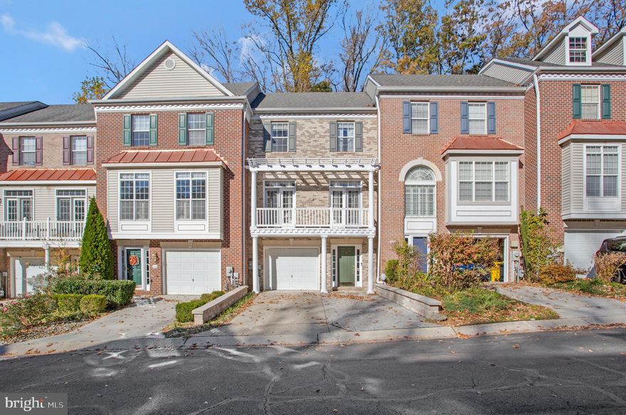 This custom remodeled Waters Edge at Woods Landing townhome is perfectly situated on a premier lot that backs to a wooded landscape, providing a private and tranquil setting. The home boasts updated features throughout, including exceptional Brazilian red hardwood floors that flow seamlessly through the living spaces on all four levels.  The living room is a bright and inviting space, flooded in natural light thanks to double sets of atrium doors leading to a balcony with pergola, and featuring a three-sided gas fireplace, creating a cozy ambience throughout, and custom built-ins provide both storage and display space which enhance the room’s functionality and style.  The exceptional kitchen is a chef’s dream, designed with high-end finishes and modern touches, and showcasing high quality wood cabinets finished with a subtle glaze that enhances the natural grain of the wood, granite countertops, and a central island with stool seating, ideal for guests and family members to gather around. Thoughtfully designed wine and coffee bars add an extra touch of convenience. The kitchen seamlessly connects to the living room and offers access to a backyard deck, where you can enjoy peaceful views of the woods behind the home, creating an ideal space for relaxation and entertaining.  The upper level boasts two well appointed bedrooms sharing a newly remodeled full bath featuring custom tiled shower with niches.  The owner’s suite captures views of the woods and features an exquisite en-suite remodeled bath with oversized shower.   The two-sink vanity with illuminated mirror offers ample space for convenience and organization and modern fixtures enhance the room’s refined atmosphere.  A private, fourth level loft adds additional, flexible space for an additional bedroom or office, and shares in the scenic views.  The entry level offers a spacious recreation room with sliding glass door access to the lower deck and fully fenced backyard, along with a powder room and laundry.  Roof Maxx application  with 5 year warranty transfers.  Community amenities include a walking trail to the waterfront with access to a fishing/crabbing pier and kayak/canoe launch.  Close proximity to Bay Bridge and Sandy Point State Park, and easily accessible to Rts. 50 and 97.