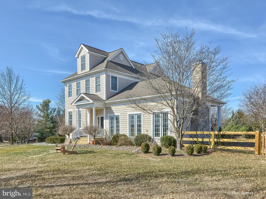 Custom home boasts large kitchen, HW floors, woodburning fireplace with antique mantel, transons, built-ins and large outdoor entertaining area. Stone walkways wrap the house and protected views (adjacent to preserved farm that will never be developed) make this professionally landscaped property ideal. Already wired and set up for Comcast High Speed Internet. Featured in Magazine "Country Home"