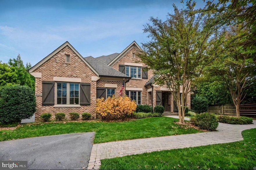 This stately all-brick Artisan Builders Custom Home offers timeless elegance. The meticulously manicured, landscaped flat backyard that presents endless possibilities, providing the perfect canvas for outdoor enjoyment and relaxation. Step into the Foyer, where bespoke details welcome you into a sanctuary of refined living. The inviting living room exudes sophistication with its exquisite molding, while the adjacent formal Dining Room and Butler’s Pantry, complete with a wine cooler, cater to effortless entertaining. The office beckons with abundant natural light streaming through large windows, complemented by French doors and built-in shelves. Unwind in the Family Room, adorned with coffered ceilings and a gas stone fireplace. Indulge your culinary passions in the dream kitchen with a large center island, walk-in pantry, custom cabinets, and beamed ceilings converge seamlessly with a breakfast room offering tranquil patio access. Functional Mud Room, featuring built-in shelves, cubbies, a work desk, and a convenient half bath. Ascending to the Upper Level retreat to the Owner’s Suite with vaulted ceilings and dual custom walk-in closets. Pamper yourself in the sumptuous bath, boasting separate vanities, glass shower and soaking tub. Additionally discover three ample en-suite Bedrooms alongside the Laundry Room. The Lower Level beckons with beautiful Recreation Room with a cozy gas fireplace and Wet Bar, while a Fitness Room with Sauna promises rejuvenation. A Bedroom and full Bath offer comfort and convenience, with abundant storage space catering to every need. A special find in a wonderful neighborhood, walking distance to the Potomac School, Langley Fork Park, Clemyjontri Playground and minutes to the George Washington Memorial Parkway.