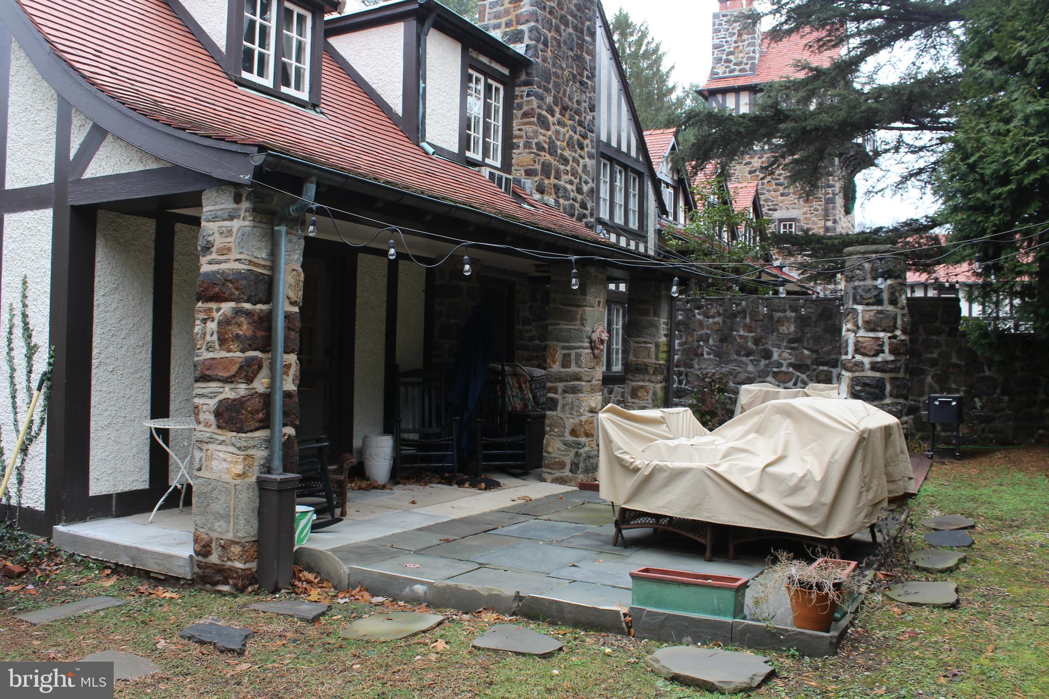 Charming and spacious stone Carriage House located in one of Bryn Mawr's most sought after locations. Light and bright throughout. 1st floor has marble island kitchen with storage galore, Dining room with outside entrance and wet bar, Living room with gas fireplace and french doors to slate terrace, Powder room. 2nd floor has Master suite with dressing room and private bathroom, 2nd bedroom. Upper floor has 3rd bedroom, 4th bedroom/den, and full bathroom. Full basement with outside entrance and Laundry. Kitchen and bathrooms have been updated. Open concept with the living/dining room. Lovely serene slate patio off the main living space completely fenced with total privacy. Garage space available for additional fee.