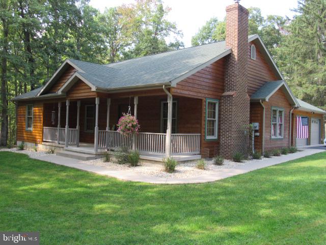 BACK TO ACTIVE - NO FAULT OF THE SELLER! SCHEDULE YOUR APPOINTMENT TODAY!! Nestled on 7.58 acres of rolling hills is this stunning one-owner cedar home offering the perfect blend of privacy and tranquility. The spacious 3 bedroom, 2 bath layout provides ample room for both cozy nights in by the fireplace and entertaining friends and family.
Step outside onto the deck and take in the peaceful views of your very own mountain retreat creating a serene backdrop for relaxing evenings as you watch the sunset and the deer play. Do you like to fish? Then spend your day fishing from the dock in your very own pond. Whether you're an outdoor enthusiast or simply seeking a quiet retreat from city life, this property has something for everyone. This is more than just a house - it's a sanctuary where you can truly unwind and connect with nature. Don't miss your chance to make this idyllic oasis in Round Top Estates yours today!