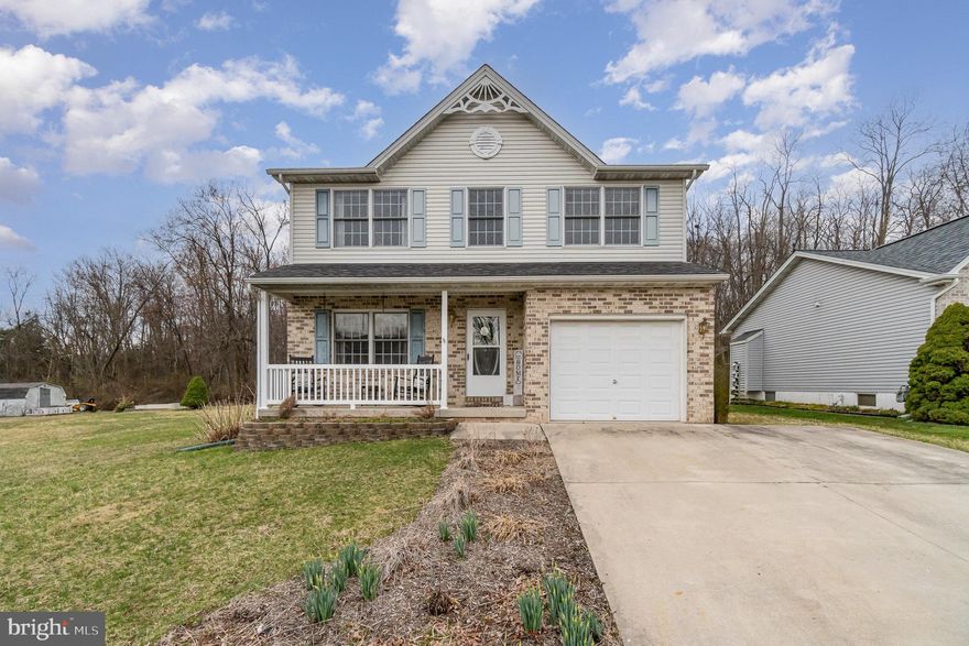 Beautiful home with 4 bedrooms and 2.5 baths located in Heritage Hills at the end of a cul-de-sac.  This home greets you with a welcoming front porch just in time to enjoy the warmer weather.  Step into the 2 story hardwood foyer with open staircase.  To the left is a formal dining room, or you can use it as a separate living room, or an office or playroom...anything you want it to be.  The eat-in kitchen includes all appliances and has lots of pretty grey cabinets for storage.  The big family room is open to the kitchen so you aren't left out of any entertaining fun.  There is even a half bath on this level for convenience.  Upstairs, the owners suite is huge and includes a walk-in closet and your own private bathroom.  3 more nice sized bedrooms and another full bath finish up this level.  The full size basement gives you plenty of space for storage, or you can finish it if you ever want more living space.  Outside, there is a 2 level deck that can fit lots of conversation pieces.  Beyond that is a nice level yard to run around in.  Hurry, this home located close to the Maryland line will not be here for long!