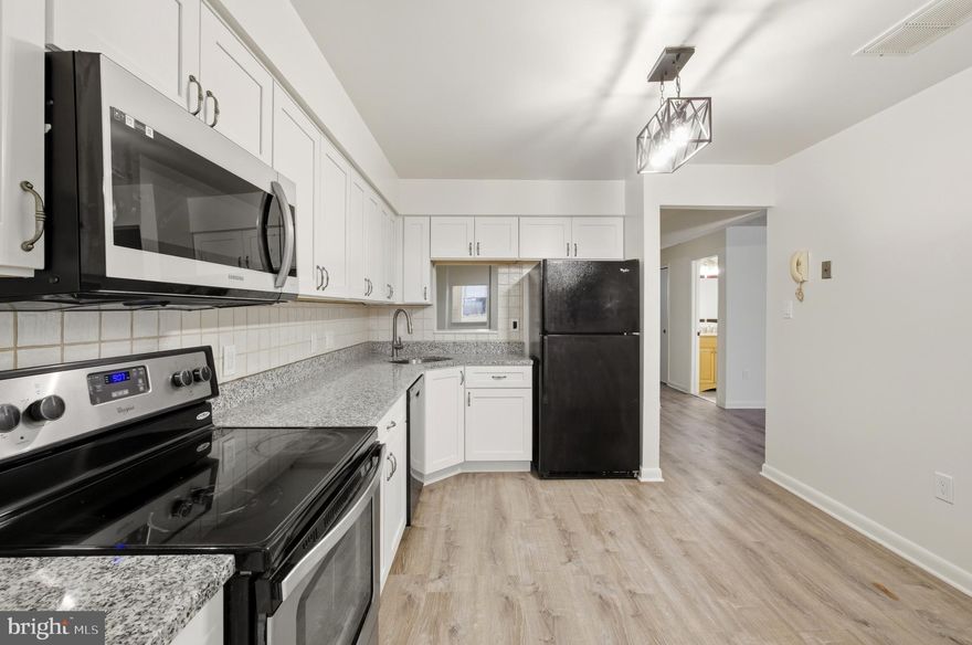 Welcome to 2211 Woodbox Ln, Unit A – a beautifully updated and spacious 2-bedroom, 2-bathroom condo. This bright and airy first-floor unit offers an open-concept living and dining area with gleaming floors, large windows, and plenty of natural light. The modern kitchen features ample cabinetry and counter space, perfect for everyday living and entertaining. The primary suite includes a large walk-in closet and private en-suite bathroom. A second generously sized bedroom and full hall bathroom provide flexibility for guests, a home office, or roommates. Enjoy outdoor living with a private patio just off the living room, ideal for morning coffee or evening relaxation. Washer and dryer in-unit for added convenience. Conveniently located with easy access to nearby shopping, dining, I-83, and more! Schedule your showing today!