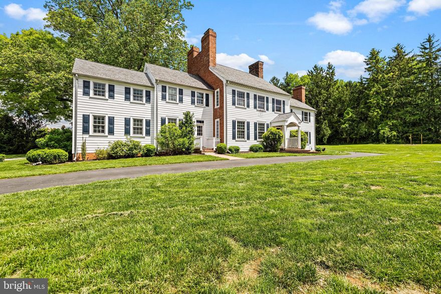 Renovated Williamsburg style 5 plus Bedroom, 5 Bath manor house. Center Hall with Colonial staircase, formal Living Room and Dining Room, each with fireplace, paneled Library with fireplace. Large eat-in updated Kitchen with butcher block and stainless steel appliances. Primary Bedroom with fireplace and updated Bath plus 4 additional spacious Bedrooms and 3 Baths on 2nd level. updated HVAC with gas heat, brick and Hardiplank siding exterior, slate roof, detached 3-car Coach House with apartment all on 1.53 landscaped acres.