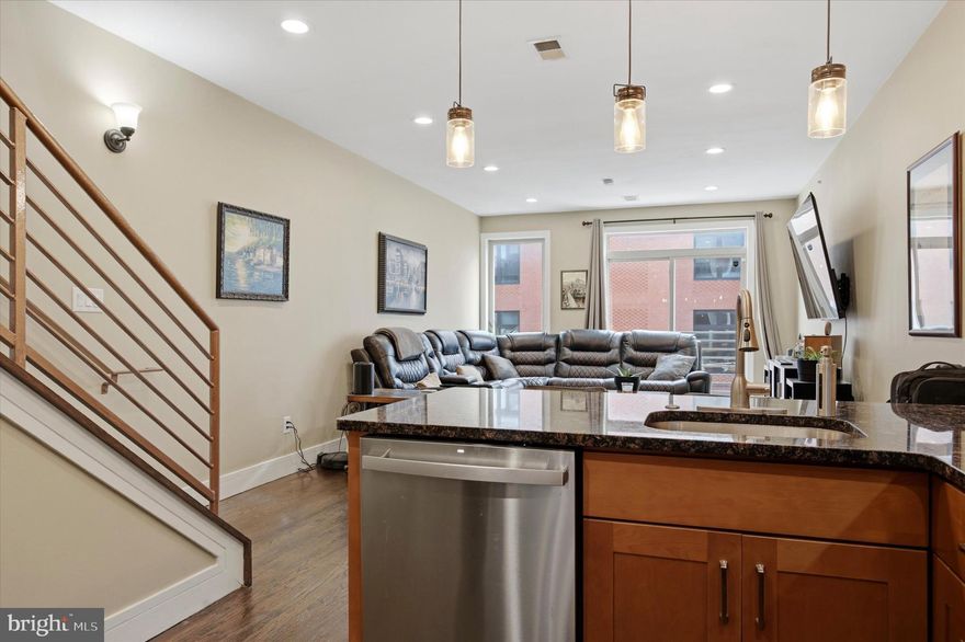 Elevate your urban lifestyle at 844 N 15th Street, Unit C, a sophisticated three-bedroom, 2.5-bathroom residence that perfectly captures the energy of Philadelphia’s skyline. Spanning 1,444 square feet of meticulously designed living space, this bi-level condo is engineered for the modern professional who seeks a seamless transition between a high-functioning workspace and a premier entertaining venue. The experience begins on the open-concept main floor, where high ceilings and a signature Juliet balcony flood the interior with natural light and fresh city air. The heart of the home is a stylish, chef-ready kitchen featuring granite countertops, a sleek tile backsplash, and a versatile breakfast bar that effortlessly serves as a casual morning workspace or a hub for evening cocktails. This level’s expansive living and dining area provides the generous footprint necessary for both quiet nights in and lively social gatherings, all anchored by contemporary finishes and recessed lighting.

The upper level is dedicated to rest and productivity, housing three well-proportioned bedrooms that cater to a variety of lifestyles. The primary suite serves as a serene retreat with ample closet space and a spa-inspired ensuite bath, while the additional two bedrooms offer the essential flexibility required for a growing family or a dedicated "double-desk" home office setup. However, the true showstopper is found just beyond the striking central spiral staircase: a massive, private rooftop deck that offers breathtaking, panoramic views of the Philadelphia skyline. Whether you’re hosting summer sunset dinners or enjoying a private outdoor workout, this sky-high sanctuary provides a level of peace and perspective rarely found in the city center.

Positioned in the geographic "sweet spot" of Francisville, this home places you exactly where you want to be—just a short stroll from the historic Met Philadelphia, the artisan cafes of Fairmount Avenue, and the world-class galleries of the Art Museum District. With a 100/100 Walk Score and a two-block walk to the Broad Street Line, your commute to Center City or University City is measured in minutes, not miles. While the new-construction frenzy of the neighborhood continues, 844 N 15th stands as a proven, high-performance asset with a stabilized HOA and a location that continues to appreciate as the city’s hottest corridor. This is more than a home; it is a strategic vantage point from which to experience the very best of Philadelphia.