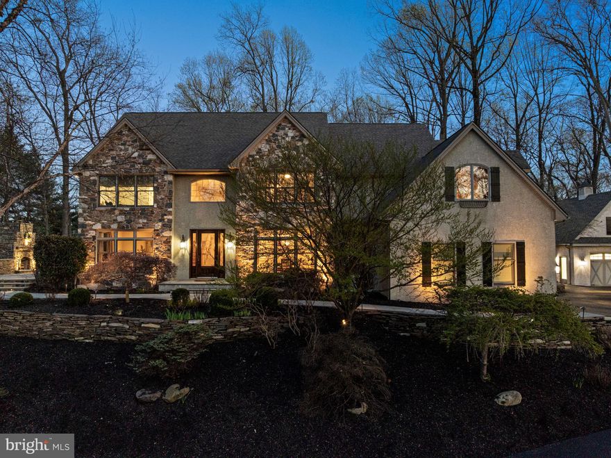 Set on nearly 3 private acres in the award-winning Unionville–Chadds Ford School District, this beautifully updated Colonial blends timeless architecture with extensive modern upgrades and exceptional indoor/outdoor living.
A welcoming foyer with a custom mahogany front door opens to light-filled formal living and dining rooms, while the spacious family room flows seamlessly into a beautifully updated kitchen featuring high end appliances, including double ovens, dual dishwashers, a paneled refrigerator, and beverage center, ideal for both everyday living and entertaining.
Upstairs, the primary suite offers a private retreat with an en-suite bath, complemented by generously sized secondary bedrooms and multiple full baths.
The home’s versatility continues with approximately 1,100 square feet of finished lower level, complete with a full bath, dry bar, and flexible living space ideal for a media room, guest suite, or au pair accommodations.
Significant recent upgrades include all new double-hung windows (2024), a whole-house natural gas generator, and updated HVAC systems, providing both efficiency and peace of mind.
Outdoor living is equally impressive, featuring an elevated stone patio with built-in fireplace, integrated lighting, and natural gas grill, along with a rear bluestone patio and fire pit, perfect for year-round enjoyment. The professionally landscaped grounds are enhanced by irrigation and landscape lighting.
Car enthusiasts and hobbyists will appreciate the rare five-car garage capacity, including a heated detached garage with storage lift potential and premium epoxy flooring.
Ideally located just minutes from Route 1, shopping, dining, and local amenities, this home offers a unique combination of privacy, upgrades, and convenience in one of Chester County’s most desirable settings.