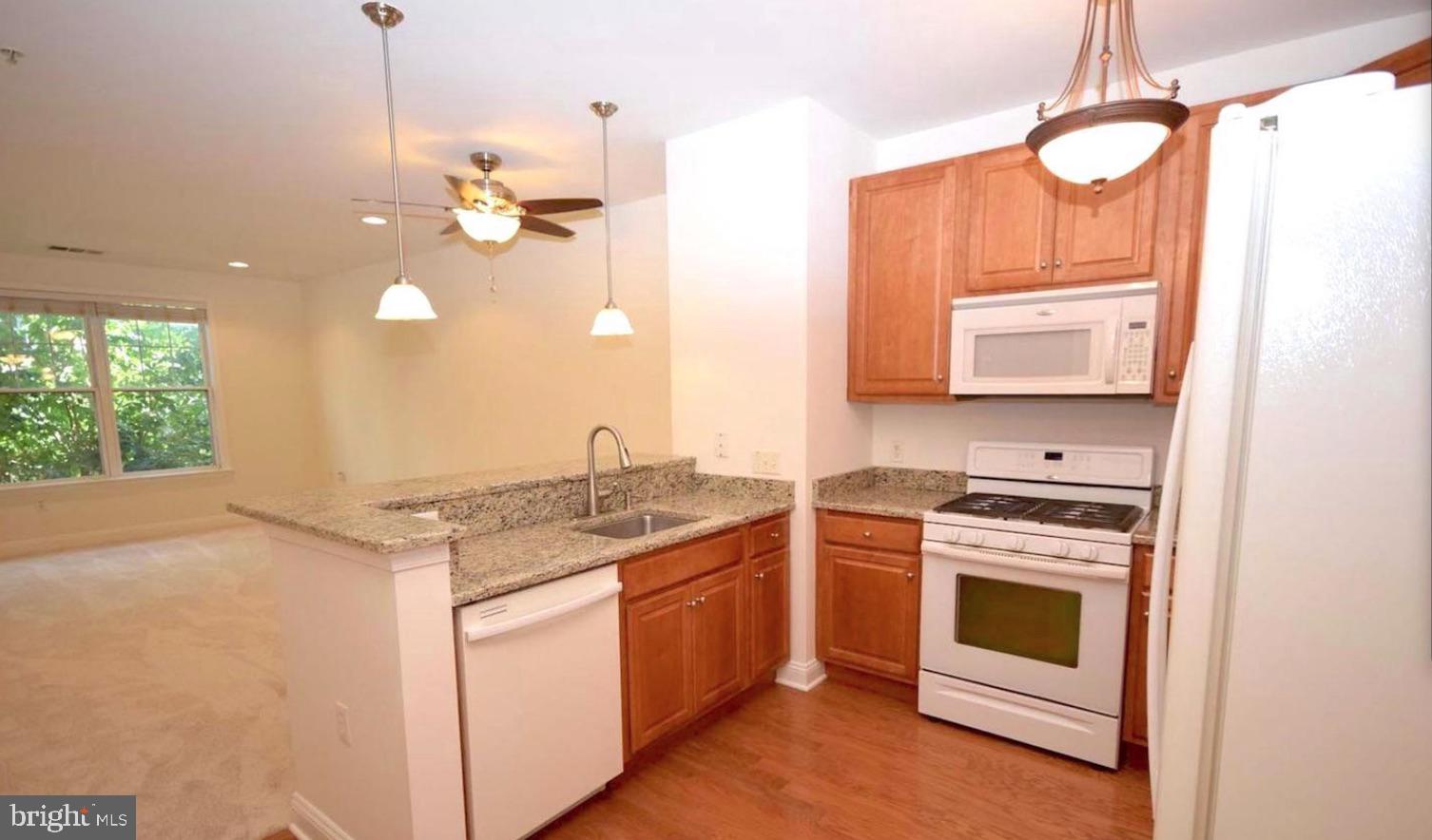 Welcome to The Grande at Riverview, one of Conshohocken’s most desirable communities, offering a truly carefree lifestyle right in the heart of downtown. This beautifully maintained Chanticleer Model is located on the second floor and overlooks the community’s serene swimming pool, complete with a patio area and locker room—perfect for relaxing or entertaining. Just steps from the Schuylkill River Trail, you can bike to Philadelphia or Valley Forge, or simply stroll to nearby restaurants, shops, nightlife, and the train station. The community also features BBQ areas, a secure parking garage with an assigned space, and fully secured entry systems for peace of mind. Inside, the condo boasts an open floor plan with 9’ ceilings, large windows that flood the space with natural light, and neutral tones throughout. The kitchen is outfitted with 42” cabinets, granite countertops, gas cooking (a chef’s favorite), built-in microwave, dishwasher, garbage disposal, pantry closet, and a breakfast bar. The living and dining areas are perfect for hosting, while the spacious bedroom features a large walk-in closet. The pristine bathroom includes a ceramic tile surround and a tub/shower combination with a wide vanity. Additional highlights include freshly painted walls, new carpet in the living room, and a convenient stackable washer and dryer. Best of all, you’ll have access to a state-of-the-art fitness center right on site—so cancel that gym membership and settle into effortless living on the river.