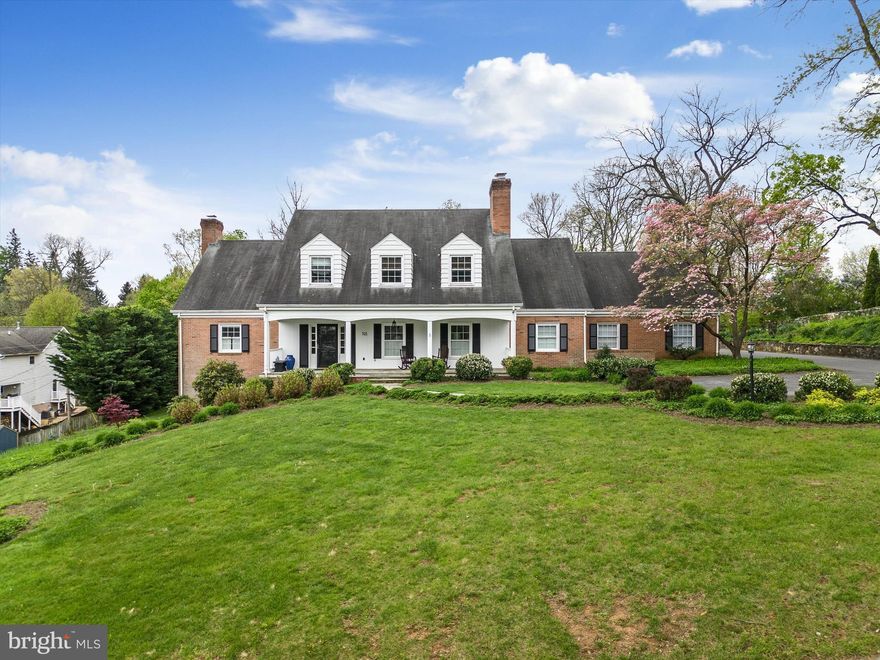 This handsome Colonial enjoys a rare spacious location in the heart of Winchester  near Handley High School. Beautifully landscaped, it is the perfect setting for large covered porches and a substantial patio.  Generously sized rooms feature hardwood throughout, a Main Floor ensuite Primary Bedroom, Gourmet Kitchen, four additional bedrooms  plus multiple venues to enjoy life on a grand scale. Adjoining lot known as 520 Miller Street and having the tax ID 211-13-A-B conveys at closing as part of the Jefferson Street property.