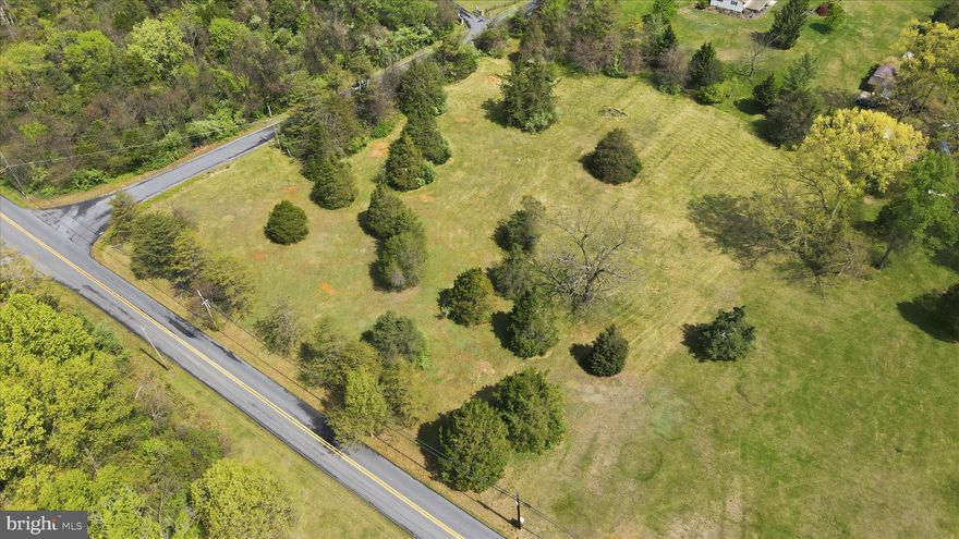 Priced to sell! Recent soil analysis confirms high clay content, making the lot a perfect candidate for the previously approved Class II Sand Mound System (new permit has been applied for.) 2.6 acres of privacy at a significant discount to accommodate engineered septic. This mostly level lot offers a fantastic location for your beautiful home  on Koontztown Road that provides an excellent setting to build your dream home, offering plenty of usable space for a residence,  garage & outdoor living.  This location offers  a perfect blend of country living and commuter access.  This parcel is conveniently close to route 11, I-81 and nearby shopping and amenities.  With easy highway access the property is approximately an 1.5 hours to Washington, DC and Baltimore making it ideal for commuters or weekend travelers. A great opportunity to build or invest in a peaceful setting while staying connected to stores and entertainment.  Welcome to wonderful West Virginia!