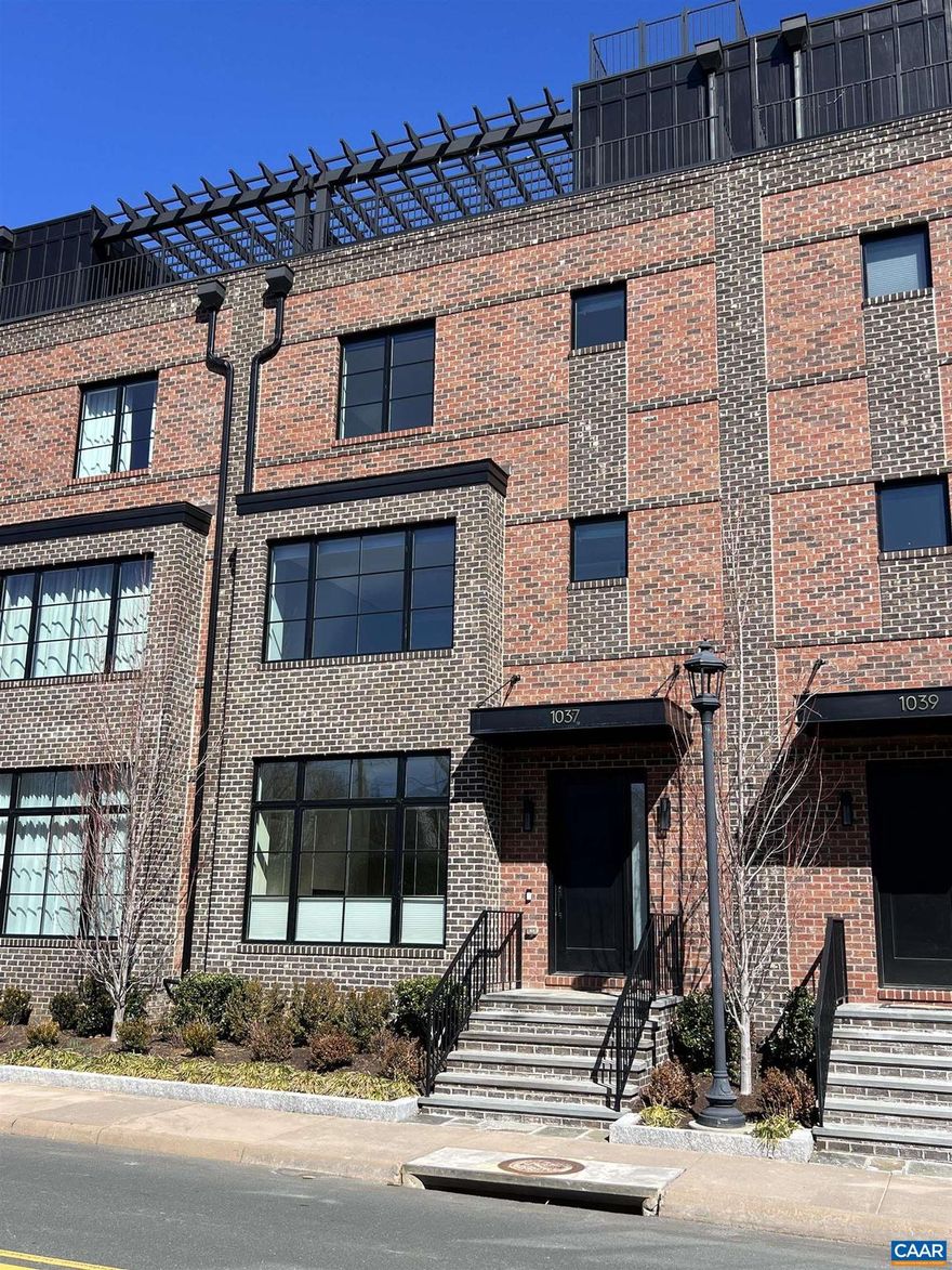 Discover the pinnacle of luxury living in this exquisite C&O Row brownstone. This elegant four-level residence offers seamless comfort w/ private elevator, two-car garage, all-brick exterior w/ covered bluestone entry, 3 large bedrooms with en suite baths and two half baths. Enjoy 10? ceilings in the kitchen and great room featuring a gas fireplace w/ built-in bookshelves & extensive trim package that elevates the home?s character. Chef?s dream gourmet kitchen featuring a 9? center island, Euro-style back-painted glass backsplash, 30? Wolf range, Sub-Zero refrigerator, water-filtered kitchen faucet. Full-floor owner suite offers walk-in closets, a study option, and a spa-like bath with designer tile surrounds. Rooftop terrace, featuring 360-degree city views, a pergola, & half bath. Electric retractable roof that covers the center of the rooftop. Kitchenette and half bath on rooftop. The HVAC system has been moved to the top roof above the elevator, maximizing space and enjoyment!  Oversized double-hung windows flood living spaces w/ natural light. White oak hardwood floors grace all living areas, enhancing the home?s warmth & sophistication.,Quartz Counter,White Cabinets,Fireplace in Living Room