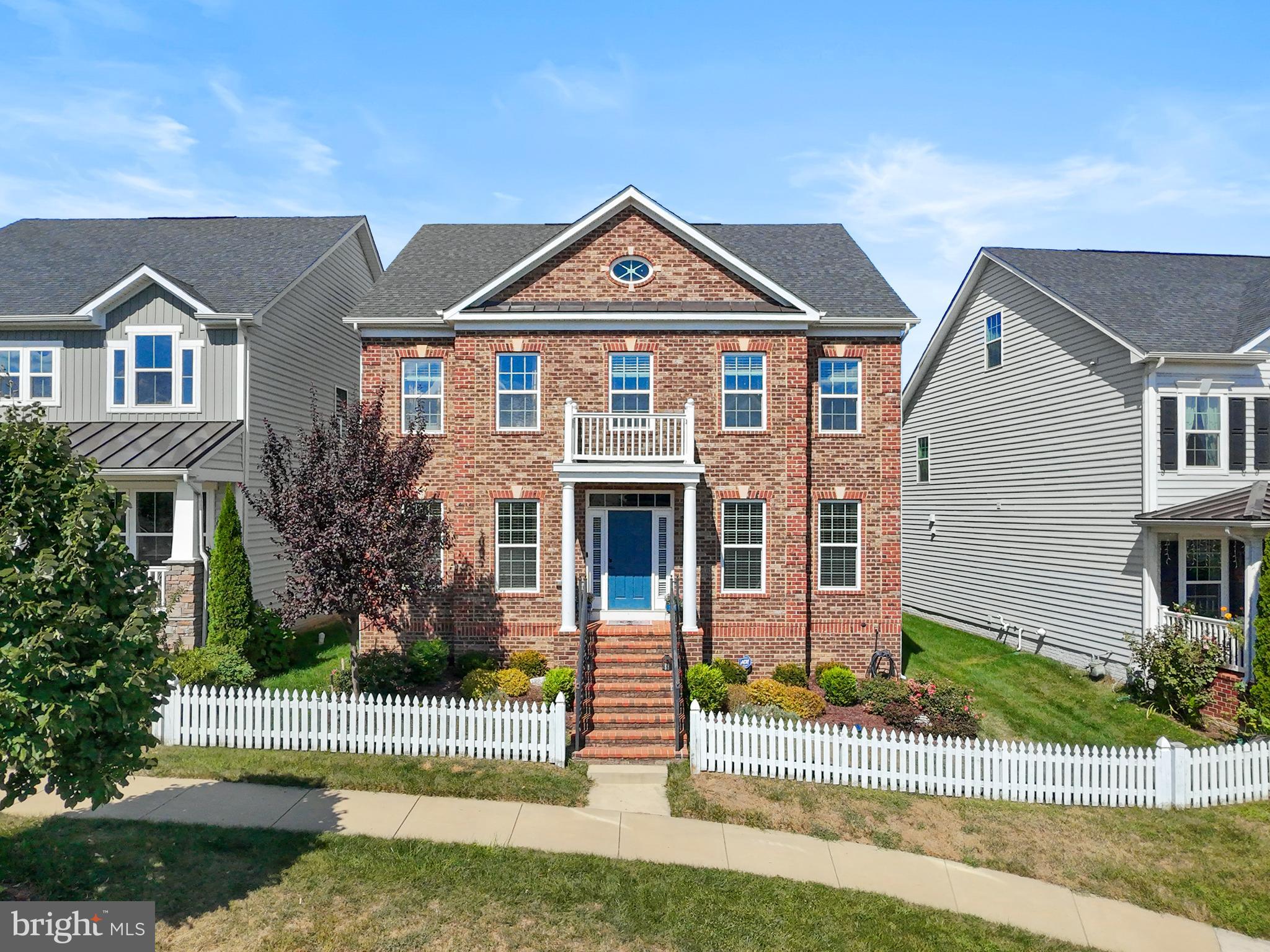 Welcome to this impressive 5-bedroom, 5.5-bath brick-front home in the sought-after Cabin Branch community of Clarksburg. With more than 5,000 square feet of living space, this residence offers generous proportions and thoughtful details throughout. The main level boasts hardwood floors, a formal dining room, butler’s pantry, and a gourmet kitchen featuring stainless steel appliances, double wall oven, central island with seating, and a bright breakfast nook. A main level bedroom with attached full bath provides flexible living options, while the family room with fireplace adds warmth and charm. Upstairs, the primary suite is a true retreat with a sitting area, soaking tub, and dual vanities, complemented by an upper-level laundry room for convenience. The fully finished basement includes a large recreation area, additional bonus room, and full bath. Outside, enjoy a fenced backyard with patio and a two-car attached garage. Ideally located near walking trails, Black Hill Regional Park, shops, dining, and I-270 for easy access to DC or Frederick. Mortgage savings may be available for buyers of this listing.