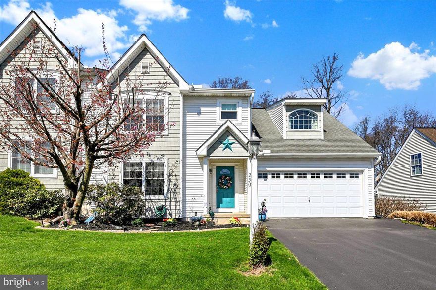 Welcome Home to this charming & spacious semi-detached home with over 1,800 sq.ft and featuring an entry foyer that opens into the stunning 2-story living room with a corner gas fireplace.  Open kitchen/dining area includes all appliances and patio doors that lead to a large deck overlooking a peaceful wooded area.   Also, a convenient 1st floor laundry and 1/2 bath. 
 The bright and cheery 2nd floor  primary bedroom includes a full bath,  hardwood floors, sitting area and walk-in closet.  The loft area overlooks the living room and leads into the second bedroom with another full bath.  A finished walk-out lower level family room with gas fireplace/stove is great for entertaining, a home office, or just an extra space to relax!