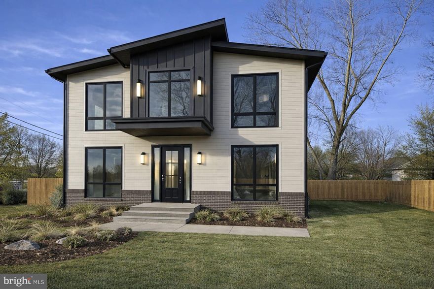 Experience elevated modern living in this 4-bedroom, 4.5-bath new construction, offering approximately 4,006 finished interior sq ft  Thoughtfully designed to blend luxury, function, and timeless style, the home welcomes you with a grand foyer featuring a dramatic cathedral ceiling, while 10-foot ceilings on the main level create an expansive, airy atmosphere, enhanced by floor-to-ceiling windows that flood the home with natural light.

The main level offers an ideal balance of open-concept living and intentional spaces, including a formal living room and a dedicated office that may also serve as a guest bedroom or flexible living area. The home flows seamlessly into the main living space, anchored by a gas fireplace that adds warmth and understated elegance.

At the heart of the home is a stunning European-inspired chef’s kitchen, designed for both everyday living and entertaining.  The main kitchen is complemented by a highly desirable prep kitchen space and separate pantry, offering exceptional functionality and storage.

Designed with real life in mind, the main level also features a floor to ceiling window, full surround sound, spacious mudroom with a dog washing station, combining practicality with thoughtful detail. 

The open layout extends outdoors to a large 85 sqft Trex deck and a fully fenced-in yard, expanding the living space and creating an ideal setting for relaxing or hosting. Upstairs, the second level continues to impress with 9-foot ceilings and a well-designed layout featuring a loft area between bedrooms, perfect as a lounge, study area, or additional gathering space. Comfort meets efficiency with dual HVAC systems, providing enhanced climate control throughout the home.

This residence delivers modern design, light-filled interiors, and refined finishes in a beautifully executed new construction.