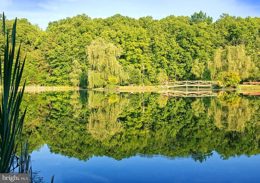 Welcome To Sunset Lake! The owner named it Sunset Lake due to the beautiful sunset over the Lake.  This property offers so many opportunities for investing, developing or personal use. The pictures show the beauty. This property offers 30. 4 acres with 1 1/2-mile Nature Trail, 5 Stone Bridges.  Pavilion with tables to enjoy cookouts, gatherings, parties and a fire pit for roasting hot dogs or smores. There are 3 Outbuildings - One is equipped with equipment to maintain the property.  The second one is a woodworking shop.  The third is used for storage.  Only 17 minutes from the Kalahari Resort & Convention Center.  Minutes from I95. Located on a 2-lane highway (Rt 606) with approx. 758 ft road frontage in Spotsylvania County.