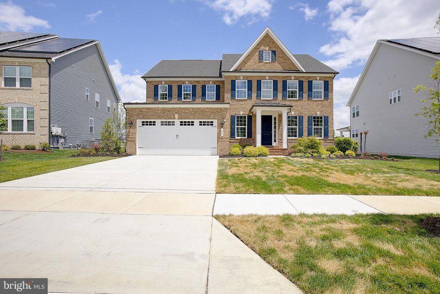 Welcome to one of Bowie's newest communities "South Lake". This is a rare opportunity to own the former modal home built by NV Homes The Longwood. There were no corners cut on upgrades to this home. Designed with all the modern amenities and open plan, the main level showcases a spectacular gourmet kitchen featuring quartz countertops, oversized center island, double wall ovens, gas cooktop, stainless steel appliances, and a walk-in pantry. The kitchen flows perfectly into the dining and living areas with luxury vinyl plank flooring. A formal dining room and covered porch add flexibility for entertaining and everyday living. The main level features a bonus room that makes the perfect 5th bedroom or home office. The upper level includes four spacious bedrooms and three full bathrooms, all with walk-in closets. The owner’s suite is a true retreat with a tray ceiling, dual walk-in closets, and a spa-inspired en suite bath with soaking tub and separate shower. A generous guest suite with private bath and two additional bedrooms with a Jack-and-Jill bath complete this level, along with a full laundry room. The finished walk-out lower level offers a large recreation room, separate media space, full bathroom, rough-in for a wet bar, and additional storage rooms. Step outside to a hardscaped paver patio, custom wood-burning fire pit, and beautifully landscaped backyard overlooking the lake. Additional highlights include lawn irrigation and a 2-car garage with epoxy floor. South Lake offers resort-style amenities including a community clubhouse, swimming pool, fitness center, scenic walking trails, playgrounds, dog parks, and beautifully maintained green spaces surrounding the lake. Don't hesitate call today for a private showing.