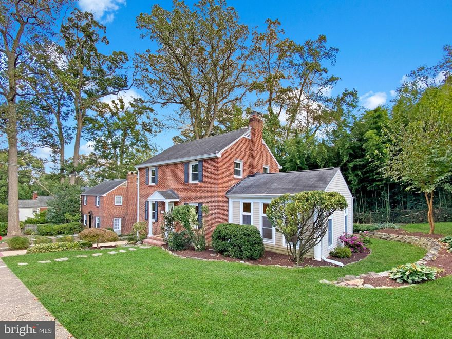 Stunning all-brick classic center hall Colonial located in the highly sought-after Madison Manor in North Arlington. This charming 3-bedroom, 2.5-bathroom single-family home is a beautiful blend of traditional charm and modern conveniences, making it ideal for today's lifestyles. Charming portico that offers excellent curb appeal and cover on rainy days; the traditional entryway leading you to the formal living/dining room-extending to the family room on one side, and a renovated kitchen with ample eating space on the other; the spacious living/dining room with a cozy wood-burning fireplace is perfect for entertaining guests or hosting dinner parties and holiday gatherings, offering enough space for a formal dining space and a comfortable lounging /conversation area; the large family room adjacent to the living/dining room is a highlight of this beautiful home, featuring a cathedral ceiling, wall of windows, and oversized patio doors leading to the large deck outside. The generous-sized eat-in kitchen features white cabinets, granite countertops, newly replaced stainless steel appliances, central island with seating, built-in desk, and breakfast nook; newly added (in 2017) half bath on the main level. Upstairs has beautifully updated 3 bedrooms, 1 full bath, and an attic with pull-down stairs for additional storage. The finished lower level offers a recreation room, full bath, Utility/Laundry room and abundant storage. The gleaming hardwood floors (installed in 2017) and recessed lighting throughout the home add a touch of elegance. The outdoor space is perfect for relaxing or entertaining: beautifully landscaped, partially fenced in, large deck with attached canopy, and stone patio pad for BBQ or a fire pit – ideal for s’mores and relaxing in the evening. You will also appreciate the newly replaced energy efficient HVAC system (2020) with Nest thermostat, the private driveway for easy parking, and direct access through the side door entry into the kitchen. Situated on a quiet street with plenty of parking, the property is within walking distance to East Falls Church Metro Station, Westover shops/restaurants, Washington and Old Dominion Trail, and various parks and recreational facilities. With convenient access to vibrant restaurants and shops, employment hubs, transportation arteries, and top-rated schools, this North Arlington gem truly has it all! Don't miss the opportunity to call this wonderful house your new home!