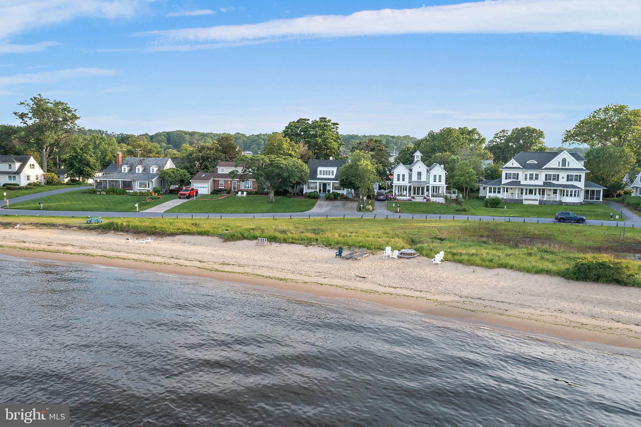 Iconic Views | 90 River Drive, Bay Ridge!
Wonderful opportunity to create your own waterfront oasis in the heart of Bay Ridge, Annapolis. Enjoy breathtaking views of the Bay Bridge and direct access to one of the area’s most spectacular private beaches. Nestled in a vibrant coastal community known for its sailing, beach walks, and friendly charm, this property offers a rare blend of lifestyle, location, and flexibility. The highly sought-after Bay Ridge community in Annapolis offers a rare blend of resort-style amenities and vibrant coastal charm. Residents enjoy a scenic community pool and clubhouse overlooking the sparkling waters of the Chesapeake Bay, as well as private community beaches on both the Bay and the River. Boating enthusiasts will appreciate the community marina, complete with a newly renovated clubhouse.
For those who prefer land-based recreation, Bay Ridge features basketball courts, ball fields, pickleball courts, playgrounds, and open green spaces, along with a year-round calendar of community events. Whether you’re walking or biking along miles of waterfront paths, the Bay Ridge lifestyle is truly one-of-a-kind.
Located just minutes from downtown Annapolis and Eastport, Bay Ridge offers the perfect balance of small-town charm and big-city access. Commuting is easy with nearby access to Routes 50 and 97, connecting you directly to Baltimore, BWI Airport, Fort Meade/NSA, and Washington, DC. And when it’s time for a getaway, the Eastern Shore and ocean beaches are just a short drive across the Bay Bridge.
Non-riparian water front. 1 ft of water front added for marketing purposes only.