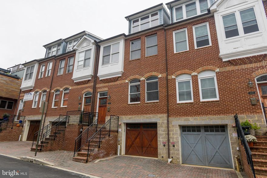 SPECTACULAR GARAGE TOWNHOME 1/2 BLOCK FROM CANTON SQUARE. BRAZILIAN CHERRY WOOD FLOORS THROUGHOUT, GOURMET KITCHEN W/ GRANITE COUNTERS & STAINLESS STEEL APPLIANCES. PRIMARY SUITE HAS LUXURY BATH W/ JETTED SOAKING TUB & SEPARATE SHOWER. TOP FLOOR PRIVATE OWNER'S SUITE W/ PRIVATE BATH, WET BAR & ACCESS TO ROOFTOP TERRACE W/ UNIQUE CITY VIEWS. FENCED BRICK PATIO. 2-CAR GARAGE.