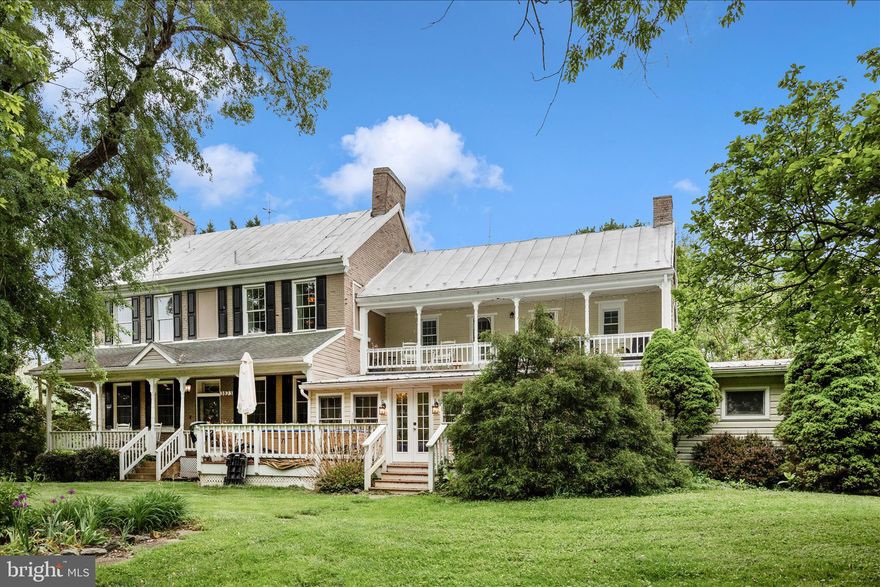 ***OPEN HOUSE SUNDAY MAY 3 1:00-3:00***Step into timeless elegance with this beautifully restored 1886 home, where historic charm meets modern luxury. Nestled on a nearly 4-acre estate, this exceptional property offers privacy, space, and breathtaking grounds filled with mature landscaping, gardens, and multiple outdoor living areas including decks, porches, a balcony, and outbuildings perfect for the avid gardener. Inside, the home has been thoughtfully redesigned for today’s lifestyle. The main level features a convenient bedroom and full bath—ideal for guests or one-level living—along with a washer and dryer off the kitchen for added ease. Upstairs, you’ll find three more spacious bedrooms, each with its own private bathroom, plus a second washer and dryer, offering ultimate convenience. The primary suite is a true retreat, complete with a private balcony overlooking the serene backyard and a unique back staircase that leads directly to the kitchen.  At the heart of the home, a stunning conservatory offers incredible flexibility as a sun-drenched dining room or relaxing sunroom, and includes a large storage room and walk-in pantry. The designer kitchen shines with high-end appliances—recently replaced in 2023 and 2024—and thoughtfully curated finishes that blend style and functionality. In 2022, the home underwent an extensive professional renovation, bringing it fully up to current building, plumbing, and electrical codes. Major upgrades completed in 2022 include a new 400-amp electrical service, all-new HVAC systems and ductwork, updated wiring and plumbing throughout, new well pump, framing improvements, upgraded insulation, new drywall, all new flooring, modern fixtures, and fresh paint throughout. Additionally, a new hot water heater was recently installed with a lifetime limited warranty.  1 EV charger is also included.  Adding even more value, the sellers are offering the home fully furnished, along with a John Deere zero-turn mower and wood chipper that convey with the property. Located just minutes from Main Street and major commuter routes, this one-of-a-kind property offers the perfect balance of historic character, modern upgrades, and a prime, convenient setting.