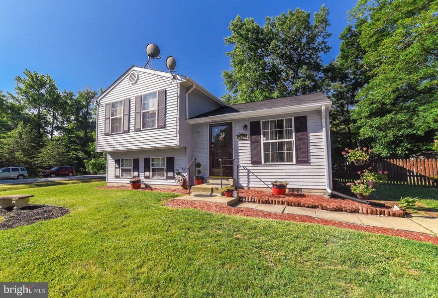 This charming corner lot is adorable. Check out the open entryway and the large fenced in backyard. This one should not be missed.