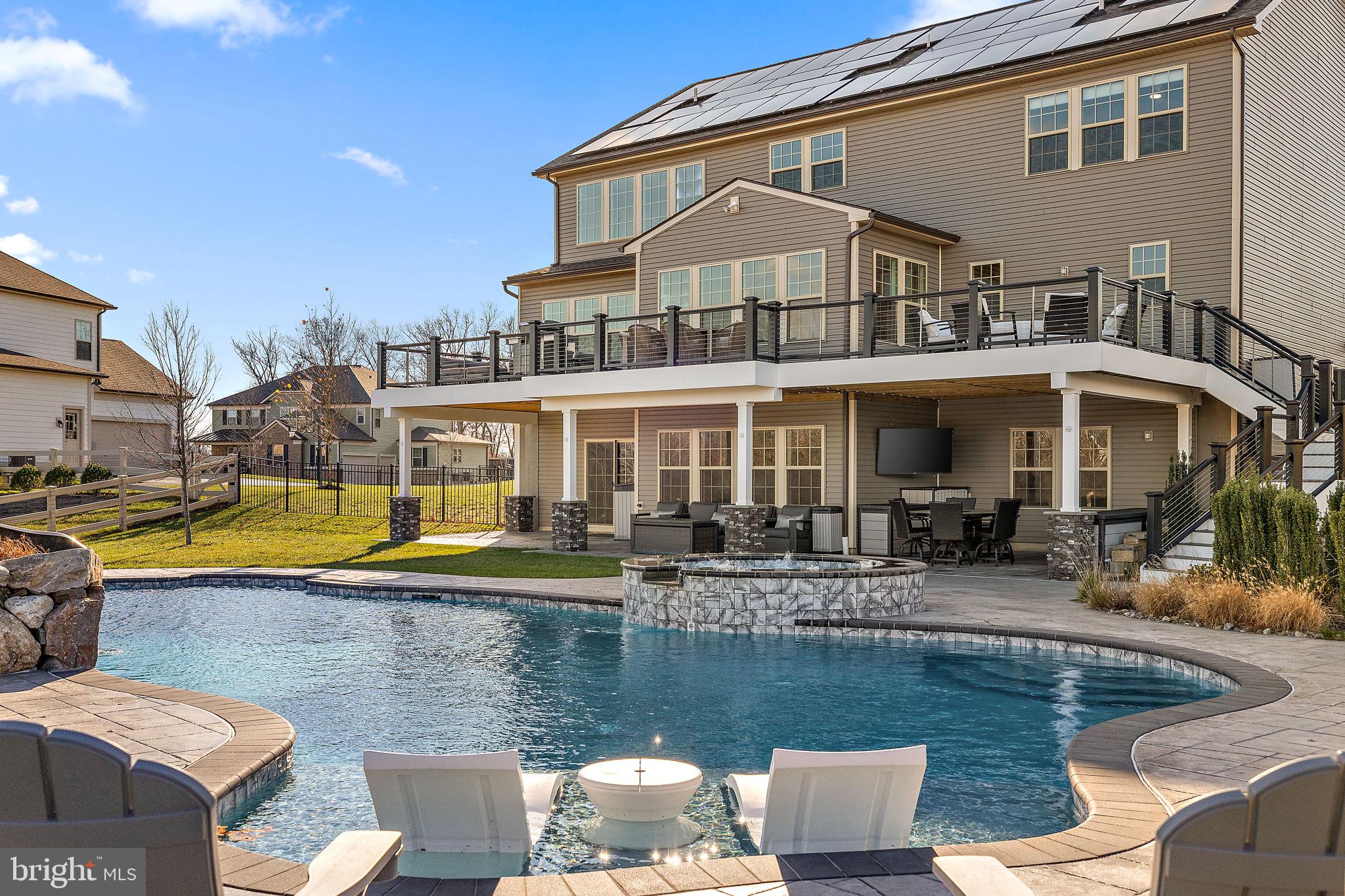Why wait to build when you can move into a like-new home with a resort-style pool and outdoor oasis?
Step into the welcoming foyer, perfectly flanked by a formal dining room and a versatile flex space ideal for a home office or sitting room. As you move further, the heart of this home unfolds into an open-concept design that seamlessly connects the great room, kitchen, and dining area—perfect for entertaining or everyday living.
The kitchen is a chef’s dream, featuring a large center island, a pantry, a bar nook, and a mudroom that leads directly to a well-appointed laundry area. The soaring two-story ceilings in the great room provide a sense of grandeur while still feeling cozy and inviting.
Upstairs, the luxurious primary suite is a private haven with a spa-like en-suite bath. It boasts a dual-sink vanity, a soaking tub, a two-person shower, and an oversized walk-in closet. Bedrooms 2 and 3 each have walk-in closets and share a thoughtfully designed Jack-and-Jill bath. Bedroom 4 also includes a walk-in closet and easy access to the hall bath. A cozy second-floor loft offers a quiet retreat, perfect for relaxing or unwinding.
The finished walkout basement is the ultimate bonus space—offering endless possibilities for recreation, a home gym, or additional living quarters.
Step outside to your own backyard oasis! This home features a spacious deck, a covered patio with custom stone accents, and an incredible pool with a spa, water slide, grotto, and sun shelf. Whether you're hosting a summer barbecue, enjoying an evening swim, or relaxing by the fire pit, this outdoor space is designed for both fun and tranquility.
Nestled in a serene setting yet conveniently located near Routes 476, 276, and 73, this home offers the perfect balance of tranquility and accessibility.
Don’t miss the chance to make this exceptional home yours—schedule a tour today!