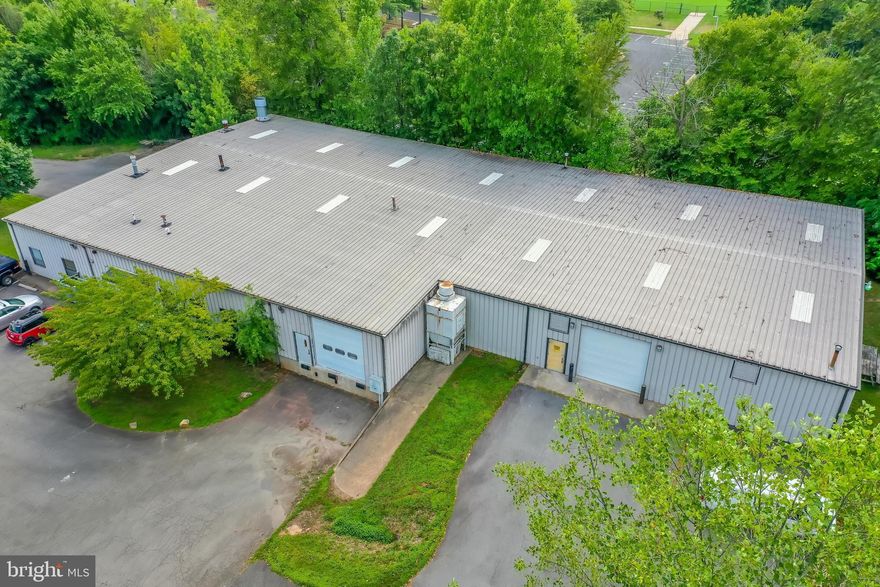 Industrial Building on 1.505 Acres in Manassas Park with 14,653 SF including 2,650 SF office/showroom .   2  Drive-in Bays and 1 Loading  Dock. 12'x 12' doors.  Parking 25+  spaces.  Outbuilding Storage unit 550 SF. Website :     https://buildout.com/website/573046-sale