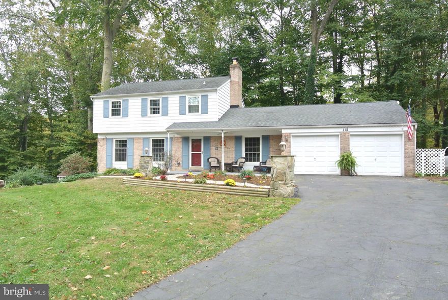 AMAZING NEW PRICE! Great Court Setting! This Beautiful 3 Bdrm/2.5 Bath Colonial Offers Part. Brick Front, Two Car Oversized Attached Garage, 3 Fin. Lvls w/2,400+ Fin.Sq.Ft. Loc. on a Priv. 0.55 Acre Lot, Backing to Trees w/Designer Paver Patio w/Secure Storage. Extensive Landscaping w/Paver Walkway Leads to Front Porch. Lrg Foyer w/Slate Tile Flrs, Decorative Moldings & Lrg Coat Closet Opens to Spac. Liv. Rm w/Hdwd Flrs, Crown Molding & Wall Sconces. The Sep. Din. Rm w/Hdwd Flrs, Crown Molding, Chair Rail & Wainscotting Opens to Lrg Gourmet Country Kit. w/SS Appl., Tile Backsplash, Under Cab. Lighting, Custom Built-In Serving Buffett w/Abundance of Counter Space & Cab. Ideal for Entertaining! The Main Lvl Fam. Rm Offers Great Space w/Hdwd Flrs, Wood Burning FP w/Brick Surround, Stone Hearth & Wood Mantle, Crown Molding, Wainscotting & Sliders Overlooking Bckyd w/Access to Oversized Garage w/Built-In Workbench. A Nicely Decorated Half Bath w/Ceramic Tile Flrs Completes the Main Lvl.  The UL Features Hdwd Flrs Thruout, a Spac. Mstr Suite w/Beautifully Updated Attached Mstr Bath Offering Barn Style Door, Ceramic Tile Roman Shower, Dual Mstr Sinks w/Stone Tops, Sep. Soaking Tub, Rec. Lights, New Lighting & Fixtures & Ceramic Tile Flrs. Two Add'l Generous Size Bdrms & Full Bath w/Tub/Shower Combo. Complete the UL. The Fully Fin. Walkout LL Offers an Amazing Rec Rm w/Wall-to-Wall Carpet, Rec. Lights & Outside Door Leading to Priv. Patio. The Custom Bar w/Wine Refrig. & Sep. Beer Refrig. is Perfect for Entertaining. You'll Love the Custom Bar Top Designed for the Maryland Fan!  Sep. Laundry Rm w/Folding Area w/Cabinets/Storage & Basin Tub, Washer/Dryer Convey. Updates Include: New SS Refrigerator (18'), Updated Main Level Half Bath (18'), New SS Dishwasher, Range and Built-In Microwave (17'), Remodeled Master Bath (17'), New Furnace with Whole House Humidifier (17'), Newer Hot Water Heater (10'), Newer Roof with 50 year Shingles (03').   A PLACE TO CALL HOME!