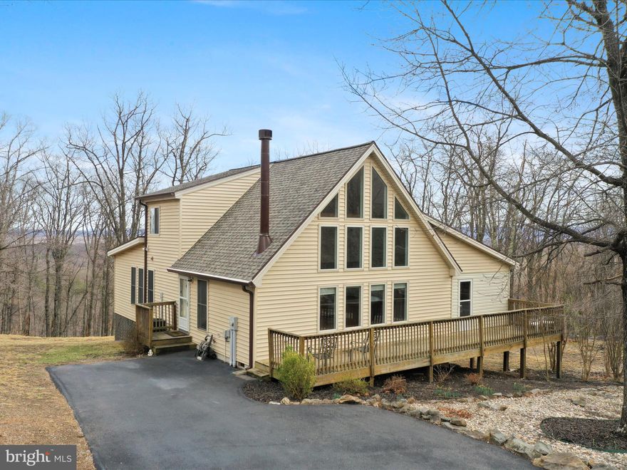 Mountain View Retreat at 283 Lookout Ridge
Perched atop Lookout Ridge, this charming Elmwood model offers a serene escape with breathtaking mountain views and a blend of cozy charm and modern updates. Featuring 2 bedrooms, 2 full baths, and an inviting layout, this home is designed for relaxation and connection with nature.
Step inside to be greeted by the spacious great room and open kitchen, where cathedral ceilings and abundant natural light create a welcoming atmosphere. Gorgeous hardwood floors run throughout, adding warmth and elegance. The main-level bedroom offers a convenient retreat with a dedicated closet for your belongings.
The family room/sunroom is a true showstopper, wrapped in windows that frame panoramic mountain views. A beautiful stone gas fireplace sets the mood for cozy evenings, while direct access to the open deck makes indoor-outdoor living effortless.
The kitchen is not only functional but also well-appointed, featuring a large pantry off the kitchen leading into the family room, providing ample storage. A stacked washer/dryer unit is conveniently tucked away for easy access.
Upstairs, the loft doubles as a flexible space, complete with a large walk-in closet and a full bath, offering privacy and versatility. The lower-level workshop is perfect for hobbies, storage, or creative endeavors.
This home has been thoughtfully updated with a freshly painted interior, a brand-new roof, and new gutters, ensuring peace of mind for years to come. A transferable Class A Membership grants access to premier community amenities for $2,600 annually, with a one-time initiation fee of $3,150.