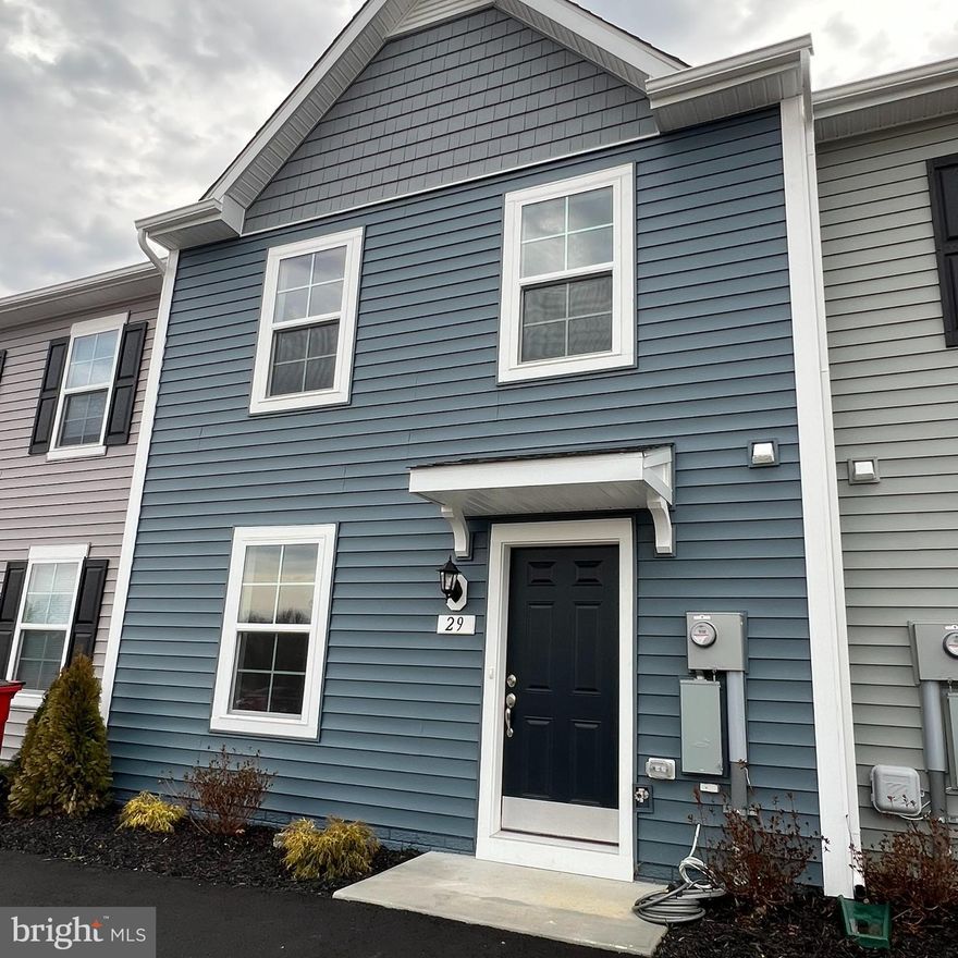 BRAND NEW!   Fresh  modern townhome unit.  Offers convenient location between Inwood and Charles Town.  Enter on the main level to the welcoming living room to the eat-in kitchen w/ large island overlooking the morning room bumpout with sliding doors to ground level rear yard.  Upper level offering a primary master suite w/ oversize tiled shower and vanity.  Two additional bedrooms, full bathroom and laundry hook-up complete the upper level.  Offering all of the modern amenities to include LVP flooring on main level, quartz countertops, stainless kitchen appliances, & sleek lighting fixtures. Exterior attached storage shed and wide driveway parking.