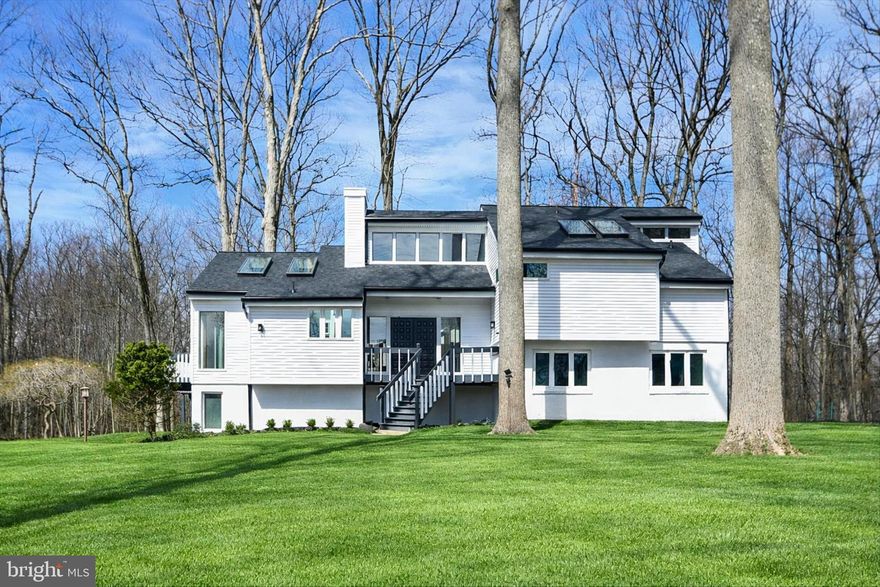 Nestled in the serene Hershey's Mill Estates, this stunning contemporary residence has undergone a major renovation in 2026, blending modern luxury with timeless charm. Highlights feature a new roof, new gutters and downspouts, new windows, new glass sliders and all new siding. Spanning an impressive 3,088 square feet, this home offers an inviting atmosphere that is both warm and sophisticated. As you step inside, you are greeted by an abundance of natural light that dances across the beautiful hardwood floors. The open-concept living area features exposed beams that add character and elegance, while two cozy wood-burning fireplaces create a perfect ambiance for gatherings or quiet evenings at home. The heart of the home, the updated kitchen, boasts a user-friendly layout and a spacious island with massive storage, ideal for culinary creations. Skylights and glass sliding doors enhance the kitchen's brightness, making it a delightful space for both cooking and entertaining. The spacious dining room offers wonderful views and beautifully refinished hardwood flooring.  Stepping down into the Great Room is truly the focal point of this home. A "wall of windows" overlooks the back yard, the warmth of the fireplace surrounded by floor to ceiling stone and the expansive vaulted ceiling are breathtaking yet, so relaxing.  The lower level includes two bedrooms, the laundry room, a full bath and the den, also with a full backyard view. A few steps down are the utilities and a bonus room that would make a perfect home office, play room, possibly a bedroom or additional storage area. On the upper level is the primary suite. It's a true retreat, complete with a luxurious en-suite bath and a generous walk-in closet with Cedar flooring and built in shelves and drawers, providing ample storage and organization. Thoughtful interior features such as wainscoting, unique lighting and ceiling fans add to the home's charm, creating a seamless blend of style and functionality. Step outside to discover mature trees on the expansive lot, nearly an acre in size, situated on a peaceful cul-de-sac. The partly wooded rear yard offers a tranquil escape, perfect for outdoor activities or simply enjoying the serene views of the nearby pond which is on an adjacent open space property owned by Hershey's Mill Estates . The large, level front yard enhances the home's curb appeal allowing the home to be set farther back on the property in lush surroundings. Parking is a breeze with an attached two-car garage, additional storage space, and ample driveway parking for guests. The property is designed for convenience and ease of living, with energy-efficient windows and a layout that maximizes comfort. Your Home Owners Association includes use of the swimming pool and tennis courts, common area maintenance, social events and a new neighbor party and holiday party. This is not just a home; it embodies an exclusive lifestyle, where luxury meets nature in a harmonious setting yet you're minutes away from the heart of West Chester, major roads, shopping and more. Experience the perfect blend of modern amenities and serene living in this exceptional property, where every detail has been thoughtfully curated for your enjoyment. Embrace the opportunity to make this exquisite home your own and indulge in the lifestyle you deserve.