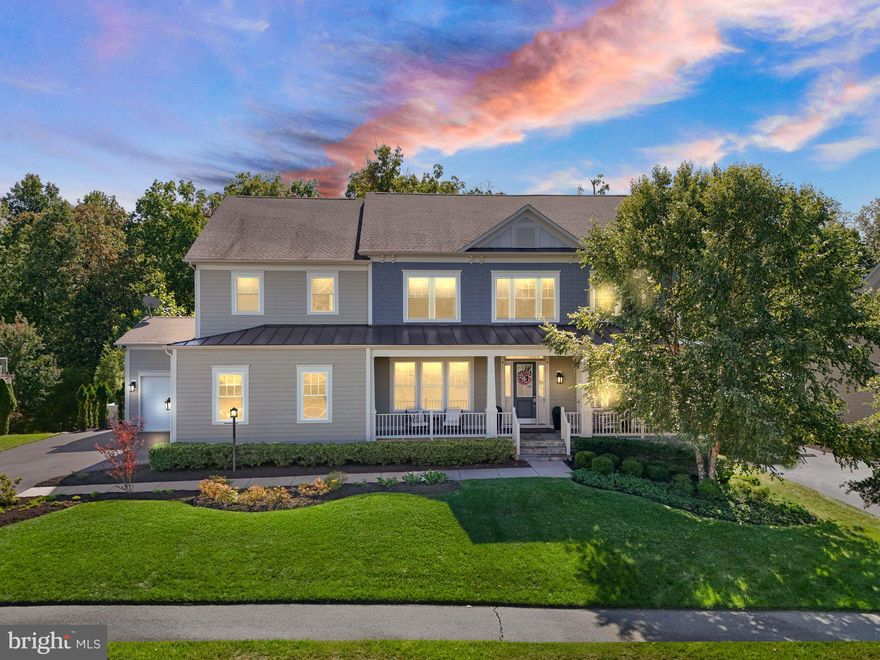 Welcome to 41865 Paddock Gate Place, an exceptional luxury residence located in the highly desirable Willowsford – The Grange community of Ashburn. This former K. Hovnanian Kensington model home showcases refined design, premium upgrades, and over 6,000 square feet of finished living space across three beautifully finished levels. Offering 5 bedrooms and 4.5 bathrooms, the home features a grand two-story foyer and a dramatic two-story family room with a coffered ceiling, complemented by engineered hardwood flooring and tile throughout, extensive custom trim work, and built-in Sonos speakers throughout the home.

The gourmet kitchen is a true centerpiece, highlighted by floor-to-ceiling cabinetry, stainless steel appliances, and quartz countertops, making it ideal for both everyday living and entertaining. The three-car finished garage, complete with an EV charger, provides added convenience and modern functionality.

Step outside to a resort-style backyard designed for relaxation and entertaining, featuring a custom deck, a custom pool with hot tub and auto cover, and elegant travertine tile hardscape. This outdoor oasis offers the perfect balance of luxury and privacy.

This remarkable home presents a rare opportunity to own a meticulously designed property in one of Ashburn’s premier communities, combining timeless elegance with today’s most sought-after features.
 Living in Willowsford – The Grange means access to award-winning amenities, scenic trails, farm-to-table lifestyle perks, and a strong sense of community. Combined with your home’s private Conservancy views and resort-style features, it’s a lifestyle that truly feels like a permanent vacation surrounded by nature.