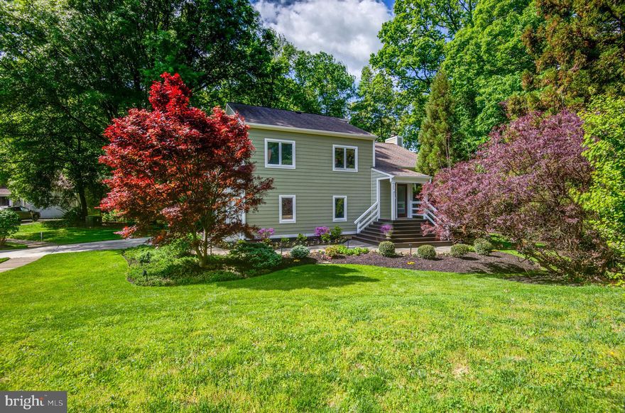 ELEGANCE NESTLED AMONG THE TREES ***ROBERT E SIMON INSPIRED***QUINTESSENTIAL RESTON BEAUTY***RARE FIND**
At the heart of this breathtaking contemporary home is a spectacular custom-designed kitchen created for both elevated living and exceptional entertaining. Anchored by an extraordinary 11-foot center island, this space offers dramatic scale, stunning functionality, and a natural gathering place for family and guests alike.

The visually captivating  kitchen offers endless custom Canadian Red Birch cabinetry providing abundant storage while seamlessly blending beauty and craftsmanship, all complemented by luxurious custom granite surfaces and designer finishes throughout.  The kitchen boasts  a 30-foot wall of windows that flood the home with natural light. Experience serene views of all 4 seasons while creating a custom culinary delight. Dining area for 10+ plus 5 more at the island!

Primary bedroom offers custom designed ensuite bath featuring limestone shower, travertine tile, Restoration Hardware vanity and shower with two shower heads -overhead and hand-held. Two additional bedrooms on this level with a separate full bath. Brand new LG washer/dryer in the upstairs hallway.

The family room has been thoughtfully updated with designer floor tiles. The gas fireplace is beautifully appointed with artisan tile work. This rooms features floor to ceiling windows leading to the spacious deck. Steps away from the deck you will be delighted to find a fire pit area giving you the feeling of being transported into nature.

On this same level is the 4th bedroom or could be used as an office with exterior door. A full bath is adjacent to this room.
The unfinished basement provides an abundance of storage and offers one of the two laundry areas.

Your clients will undoubtedly fall in love with this home.