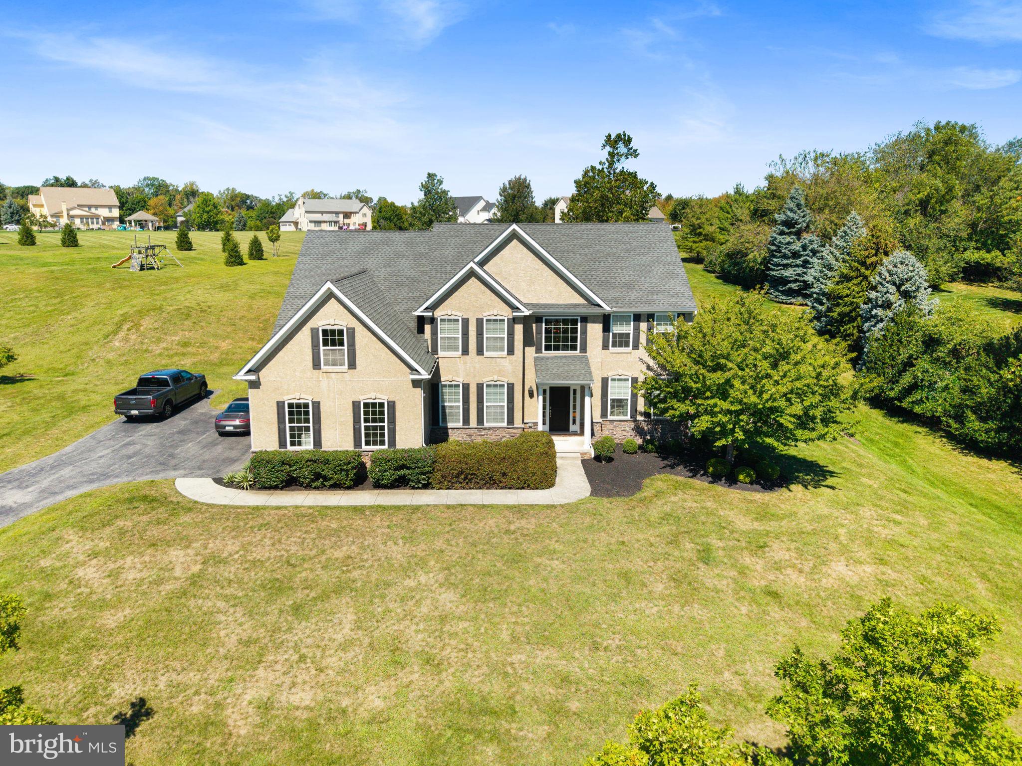 Welcome to 1403 Reiner Road, an exceptional residence in the prestigious community of “The Stables” in Worcester, within the highly sought-after Methacton School District. Perfectly positioned on one of the most coveted lots in the neighborhood, this custom-built home sits on nearly an acre of land, backing to serene community open space for unparalleled privacy and tranquility.
Step inside to discover an open, light-filled layout that blends timeless elegance with modern comfort. The dramatic two-story foyer, with its sweeping staircase, introduces the home’s sophisticated style. On one side, a formal living room with custom built-ins creates an inviting retreat, while the opposite side features a gracious dining room that flows seamlessly into the gourmet kitchen.
At the heart of the home lies a magnificent two-story family room, featuring a gas fireplace. The chef’s kitchen is a true masterpiece, showcasing double ovens, custom cabinetry, granite countertops, a large pantry, and an oversized island with seating. Just beyond, a private study with French doors, a well-appointed powder room, dual coat closets, and a spacious mudroom with a secondary entrance complete the thoughtful main-level design.
Upstairs, the luxurious primary suite impresses with a vaulted ceiling, an expansive custom walk-in closet, and a spa-inspired en-suite bath featuring a soaking tub, oversized shower, dual vanities, and a private water closet. Three generously sized bedrooms are complemented by a hall bath and a large laundry room with a sink and a commercial-grade washer/dryer.
The lower level features soaring 9-foot ceilings and endless possibilities—whether finished into a home theater, fitness studio, or entertainment lounge, or kept as expansive storage. Outside, the backyard is an entertainer’s dream, with a paver patio and peaceful views, offering the perfect setting for gatherings or quiet evenings under the stars.
Ideally located near Merck, GSK, Pfizer, and King of Prussia, this property blends convenience with unmatched luxury. Whether you’re looking for a welcoming community, top-rated schools, or proximity to parks and recreation, 1403 Reiner Road is the perfect place to call home.