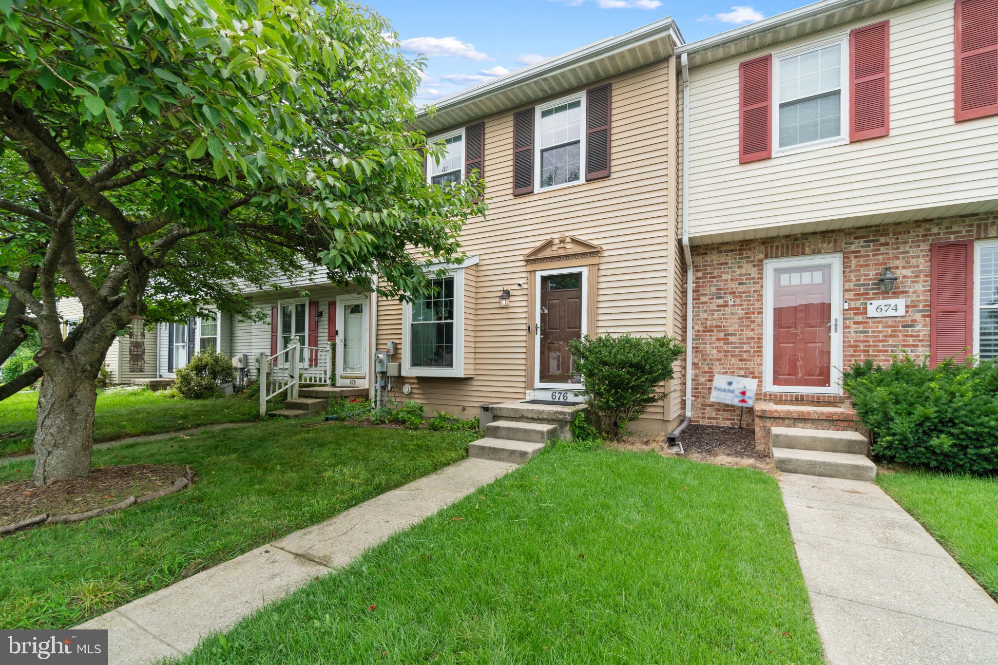 Welcome to 676 Cog Ct. tucked away in a tree lined community close to Annapolis and Glen Burnie. This three bedroom townhome has one full bathroom and half bathroom and a bonus den. This home has smart home features including Nest smart lock and touch keypad, smart assistant controlled through smart phone lights, Nest smoke/CO2 detector, and Nest Thermostat. Walk into the front door where you will find a dining room to the left and the half bath off of the hall. The kitchen is also to the left and just beyond sits the living room is on the back of the home. On the rear of the living room main level a sliding screen door opens to a beautiful deck overlooking the greenery of the manicured and gardened fenced in back yard. The gardens in the backyard have irrigation running to them so that growing can be abundant. Up the stairs you will find three generously sized bedrooms with a full bathroom that is accessed from the hall. The basement features a large utility room with washer/ dryer and enough space for tons storage. Further towards the rear of the basement you will find a finished room that can be used as a second entertainment area or den. There is a door off of the rear of the basement which leads to the backyard. There are several gardens bearing fruit and vegetables that convey to the buyer. Enjoy upgraded flooring through the basement and main level. This home comes with two assigned parking spaces located right in front of the home. Lastly, this home is eco-friendly and has solar panels that have taken the bill from approximately $160/ month to $65/ month. The solar panels are paid for in full and convey with the home. Peaceful , tech savvy and eco-friendly living awaits at 676 Cog Ct.