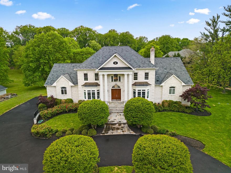 This luxury estate home exudes grandeur at every turn! It's the perfect blend of classic elegance and modern amenities. An award winning home featured in Washingtonian Magazine! With impeccable architecture, natural light filled rooms and numerous amenities offered inside & out--you'll feel like royalty. The grand entryway and curved staircase set the tone as you enter this spectacular home. Five gas fireplaces, hardwood floors throughout and a wood paneled library are just a few of the features that complete this one-of-a-kind home. 

The gourmet chef's kitchen is an entertainer's dream complete with high-end stainless steel appliances, a large center island and custom cabinetry. There is plenty of room to make memories with your family & friends in the formal living, dining, & two-story family rooms as well. French doors lead out to the expansive deck that overlooks the picturesque natural surroundings. The landscaping has been carefully designed with lush, mature trees and colorful blooms providing a peaceful oasis. Other outdoor features include a fire pit for cozy nights outdoors. 

You'll be wowed by the main level owner's suite with its spa-like bathroom, spacious jacuzzi tub, frameless glass shower and luxury finishes.  It has dual walk-in closets, a sitting room and French doors to the deck. The upper level offers additional bedrooms with en-suite baths plus a second owner's suite ideal for multi-generational households, providing plenty of comfort and privacy. Maybe it’s a parent moving in, a sibling who needs a room for a few months, or a distant relative looking to stay for a night. Whatever the scenario, the built-in convenience makes everyone feel at home. The finished lower level provides even more space for entertainment and relaxation with a 7/1 Dolby Stereo Theater and media room, wet bar, fitness area, rec room and an in-law suite.

Whether you're looking for a place to relax and unwind or entertain guests, this luxurious estate has it all. With its classic elegance and modern amenities, you'll feel like royalty while enjoying the peaceful surroundings and the highest quality of living that this property provides. All this conveniently located minutes to Tysons Corner, Reston Town Center and Silver Line Metro with easy access to major commuter routes. Come live your best life here!