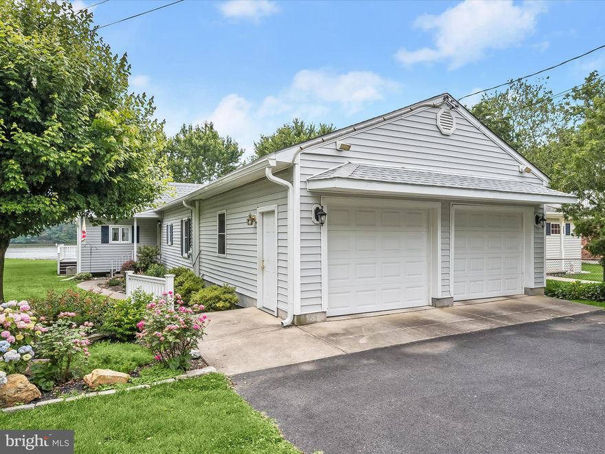 Nestled on a peaceful 0.32-acre waterfront lot, this charming three-bedroom, two-bathroom home offers convenient one-level living.The spacious living room, dining area, and eat-in kitchen with a breakfast bar all provide picturesque views of the water, creating a warm and inviting atmosphere. The dining room features elegant French doors that open to a large rear deck, perfect for outdoor dining and relaxation. Down the hall, the primary bedroom boasts an ensuite bathroom. Two additional bedrooms, a second full bathroom, and laundry complete the inside. Enjoy spending time outside in the expansive waterfront rear yard with space for everyone’s activities. The home also includes an attached two-car garage, and a shed with ample storage space. An unfinished basement with outside access offers additional storage options. Ideal for those seeking both comfort and convenience, this waterfront gem is a rare find and a serene retreat outside the city. Conveniently located in Middle River with access to everything you need.