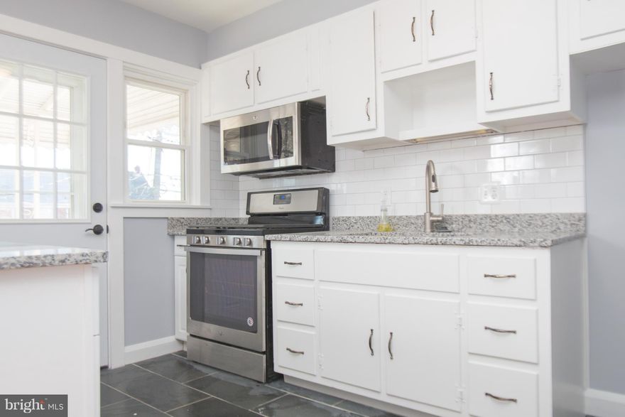 Updated brick townhouse w/ gas heat, central air, club room, wood floors, extra attic insulation, covered balcony w/ walkout basement level, fenced back yard and front patio & more! ALL NEW SINCE 2018 gas range; microwave; garbage disposal;  storm doors; kitchen counter tops & floor; ice maker; and entire interior recently painted! SEE IT TODAY