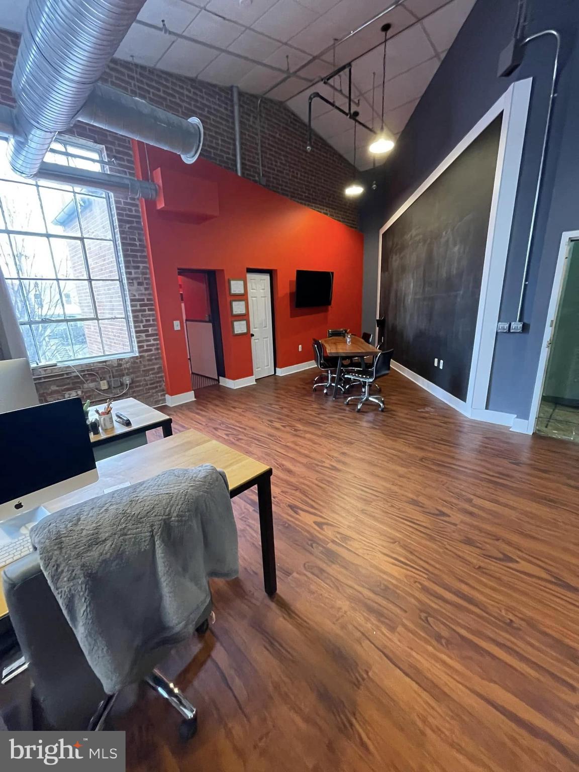 Condo for LEASE Suite 204A - 973 SF @ $21 SF - contains a Conference / Office Room, Large Open Area, and Large Kitchen Area.