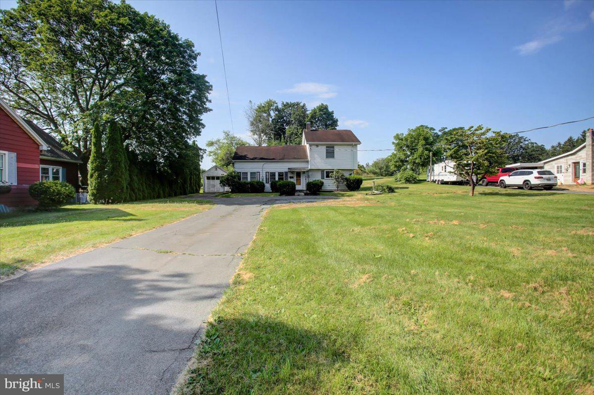 🏡 Welcome to 312 Roxbury Road in Shippensburg, PA — located just on the outskirts of the borough, this charming home offers comfort, space, and functionality. Let’s take a tour!
As you step through the front door, you’re greeted by the dining area, a bright and open space perfect for gathering. Just off to the right is the kitchen, complete with vinyl flooring and laundry hookups conveniently tucked in for easy access.
Now, turning to the left of the dining area, you'll enter the living room. This cozy space features beautiful hardwood floors and is filled with natural light streaming through multiple windows — a great place to relax or entertain.
Just off the dining room, you'll find the main-level bedroom, which includes its own private ensuite full bathroom — ideal for a main-floor primary suite or comfortable guest accommodations.
Heading upstairs, you'll discover two spacious bedrooms and another full bath. One of the bedrooms offers a walk-in closet, while the other features both a walk-in and additional storage space — perfect for staying organized.
This home is equipped with dual-zoned natural gas heating, with furnaces located in both the basement and attic. The central A/C system cools the main level, and the ductwork is already in place if you’d like to extend cooling upstairs.
Downstairs, there's an unfinished basement with two separate exits, offering great potential for extra living space, a workshop, or storage.
Outside, the property includes a detached one-car garage and two attached storage sheds, giving you plenty of room for tools, lawn equipment, or seasonal décor.
If you’re looking for a home with flexibility, natural light, and practical features — all just minutes from town — 312 Roxbury Road is worth the visit.