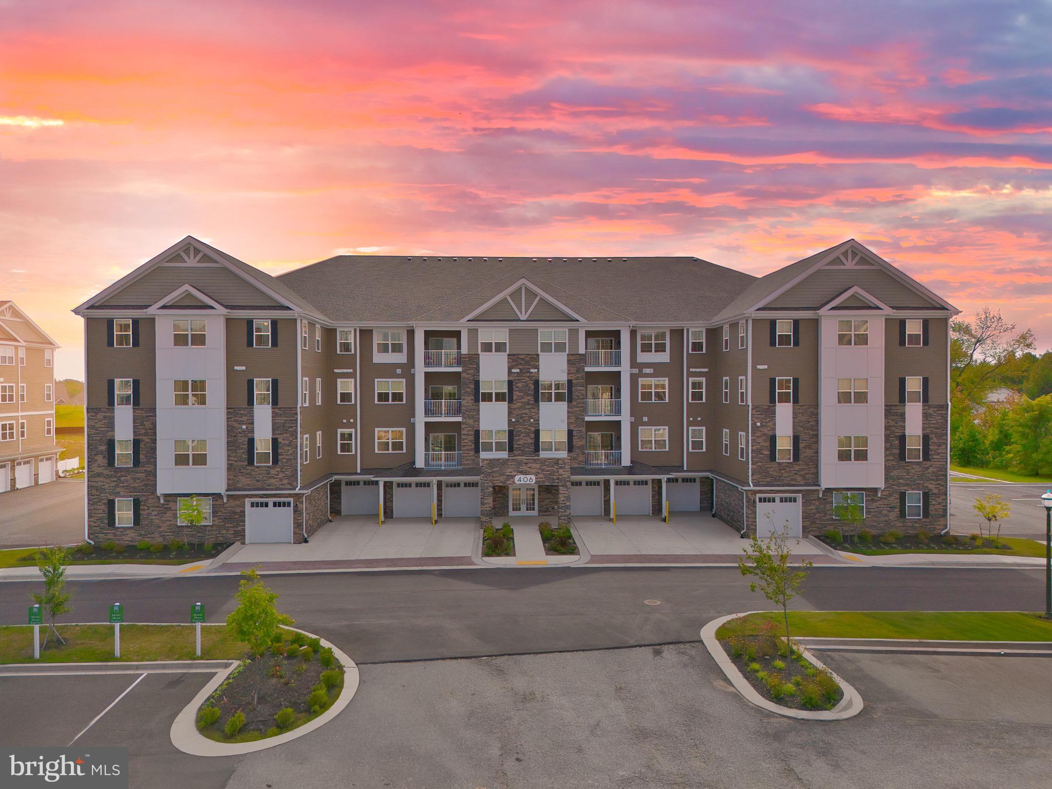 Nestled within the prestigious BULLE ROCK community, this exquisite penthouse offers a lifestyle defined by elegance, comfort, and convenience. The exterior blends timeless stone and vinyl siding with extensive hardscaping, creating an inviting and sophisticated first impression. Thoughtful landscaping and tasteful exterior lighting enhance the charm, while a private balcony invites you to savor morning coffee or unwind in the evening.
Inside, every detail has been curated for comfort and style, with modern conveniences such as in-unit laundry facilities and a thoughtful, open design that makes the home as functional as it is beautiful.
This residence also includes a separately deeded oversized garage—one of only two this size in the entire building—as well as one of the largest separately deeded storage units, offering unmatched space and convenience.
The gated BULLE ROCK community is designed for those who appreciate the finer things in life. Residents enjoy exclusive amenities including a heated indoor pool, a resort-style outdoor pool, tennis courts, a fitness center, and a beautifully appointed Residents Club and recreational center. Safety and peace of mind come standard with a secured main entrance and a 24-hour security gate. Paved and private parking areas further enhance ease of living.
With common green spaces, jogging and walking trails, and optional golf memberships, Bulle Rock offers more than just a home—it offers a vibrant lifestyle. This penthouse represents the perfect blend of luxury, functionality, and community in an exceptional setting, where every detail has been thoughtfully crafted to offer an unparalleled living experience.